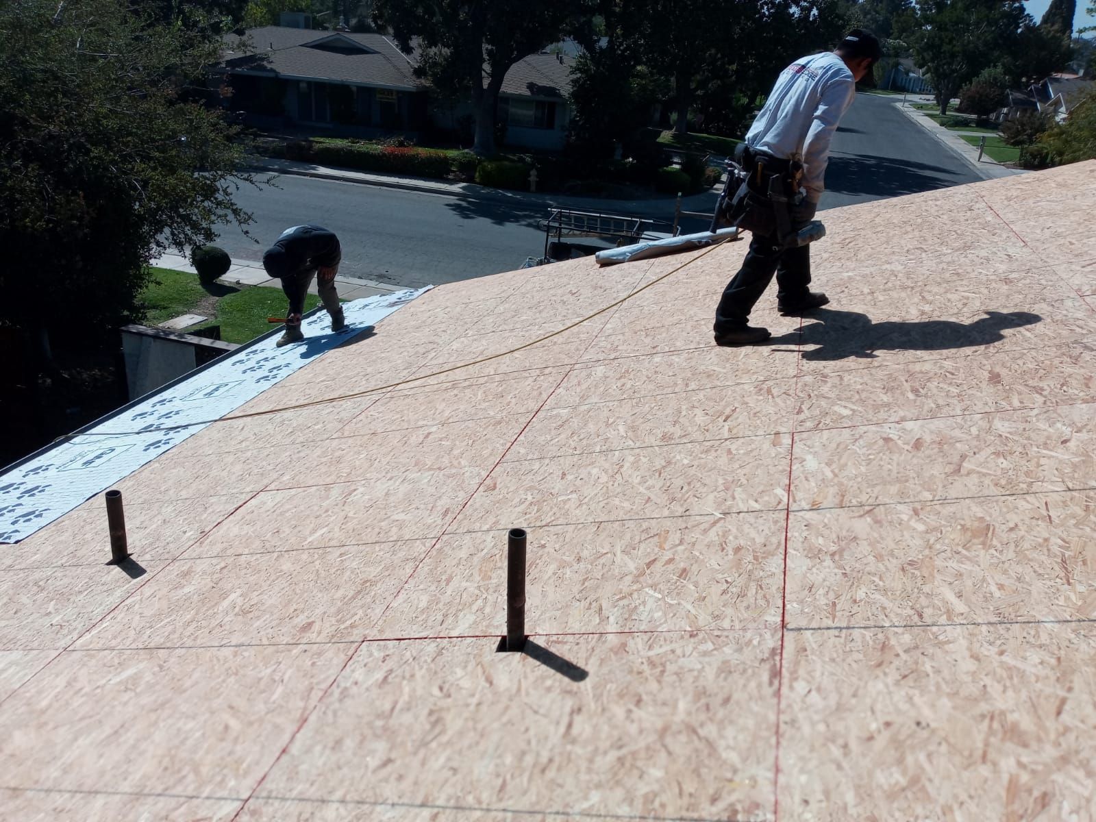 Tile roof remodel/ install OSB sheathing under tile and replace using OSB board with new underlayment, tile, and battens by Straight Edge Roofing Inc