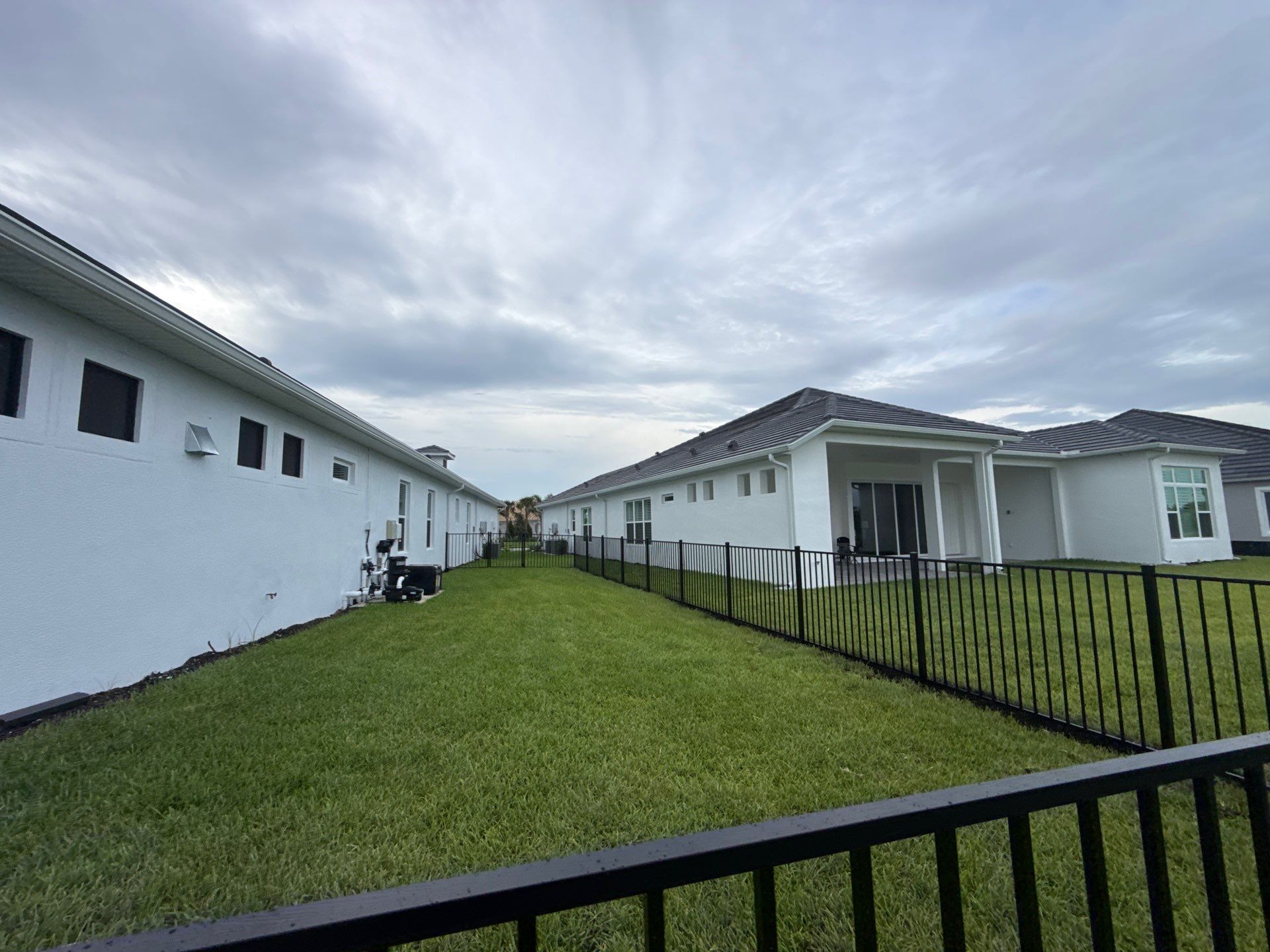 Black Aluminum Picket Fence Installation in Venice, Florida by True Fence LLC