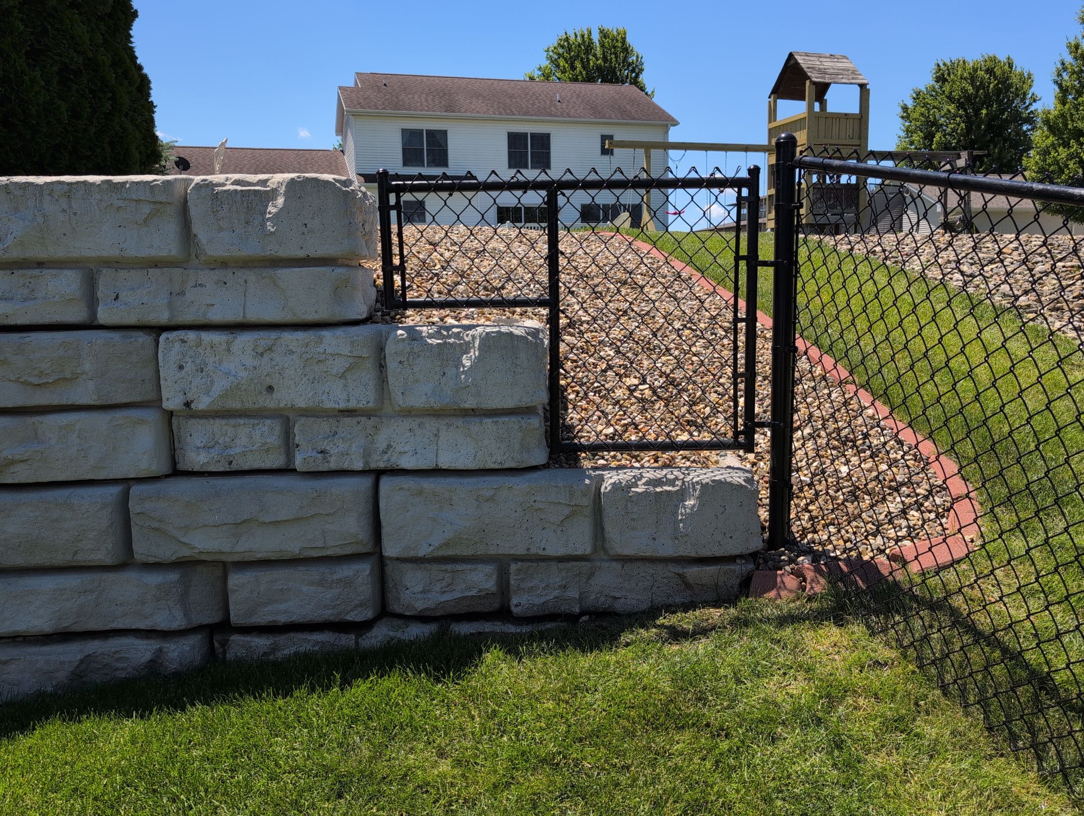 Black Vinyl-Coated Chain Link Fence Installation in Denver by Perfect Picket Fence and Stain