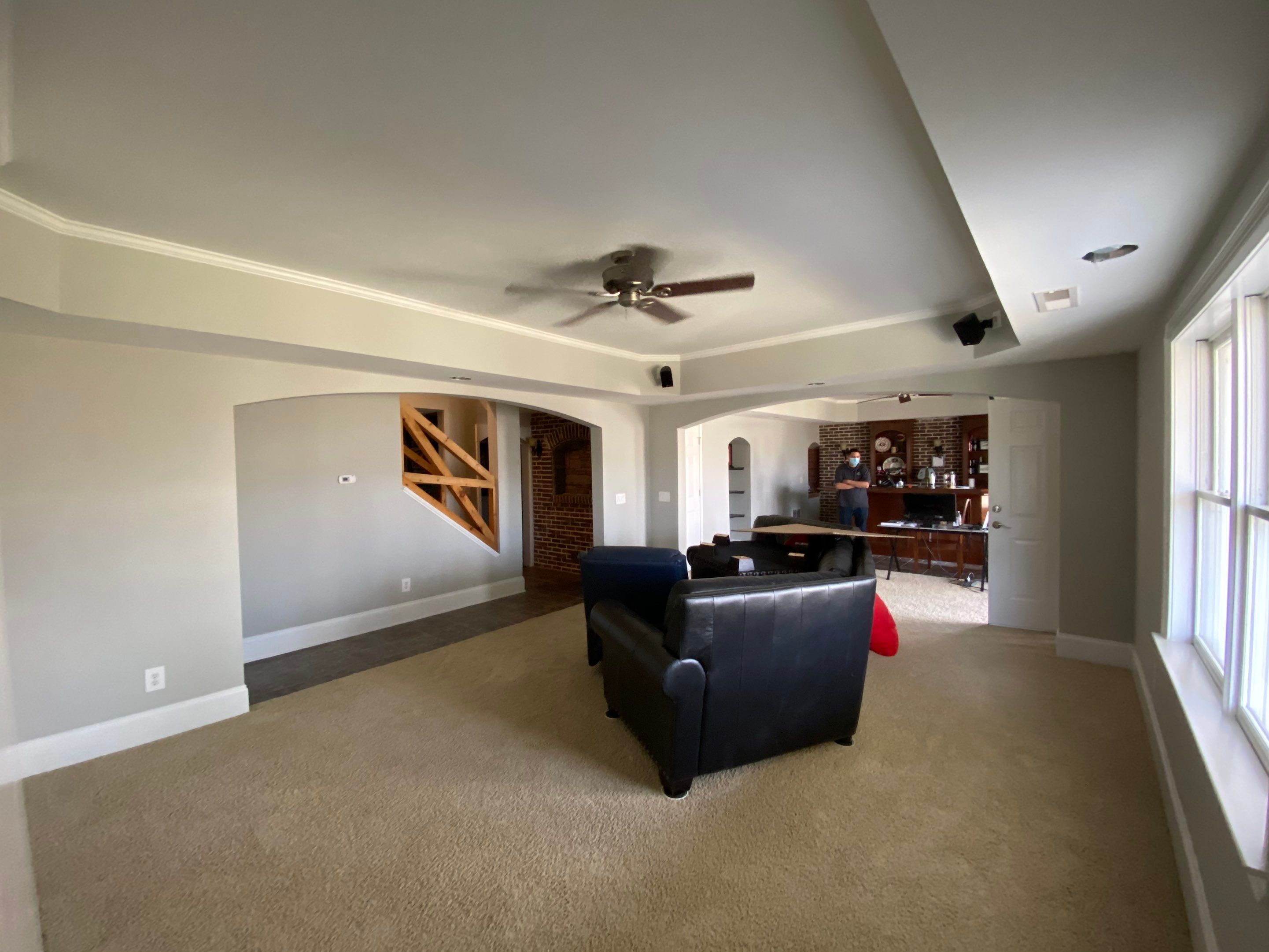 Finished Basement Renovation with Custom Shiplap and Modernized Wood Railings by Swift Home Renovations 