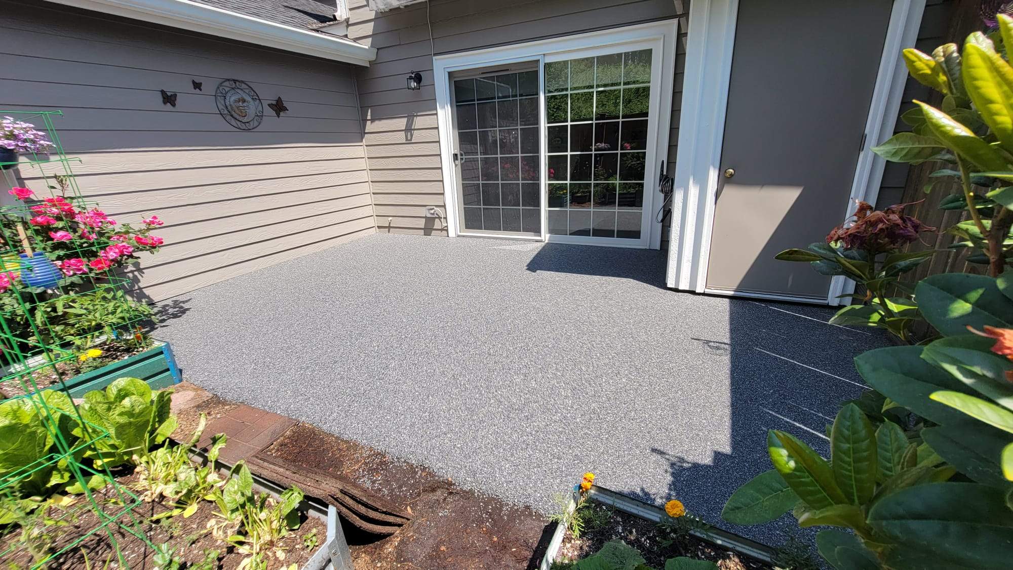 Urban Elegance Back Patio in Manhattan Vuba Stone by Concrete Coating Experts Inc.