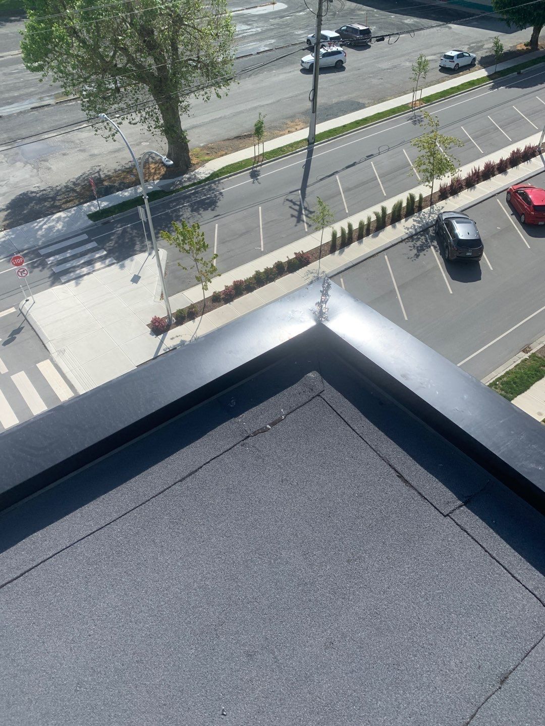 Large apartment with sbs, shingles and prolok metal  by Top Notch Roofing Inc