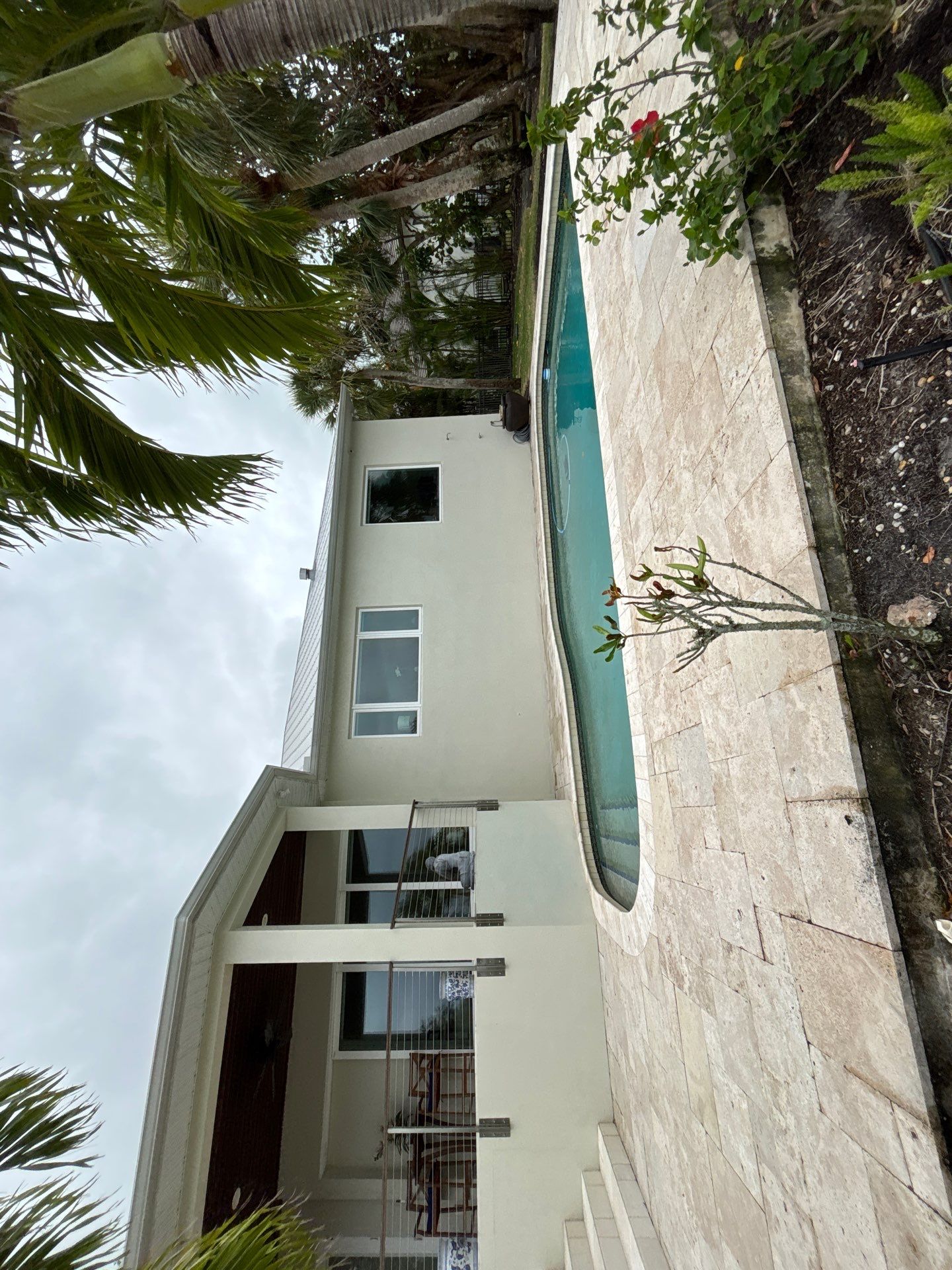 6-Inch White Seamless Gutters Installation in Siesta Key FL by Gutter Professors