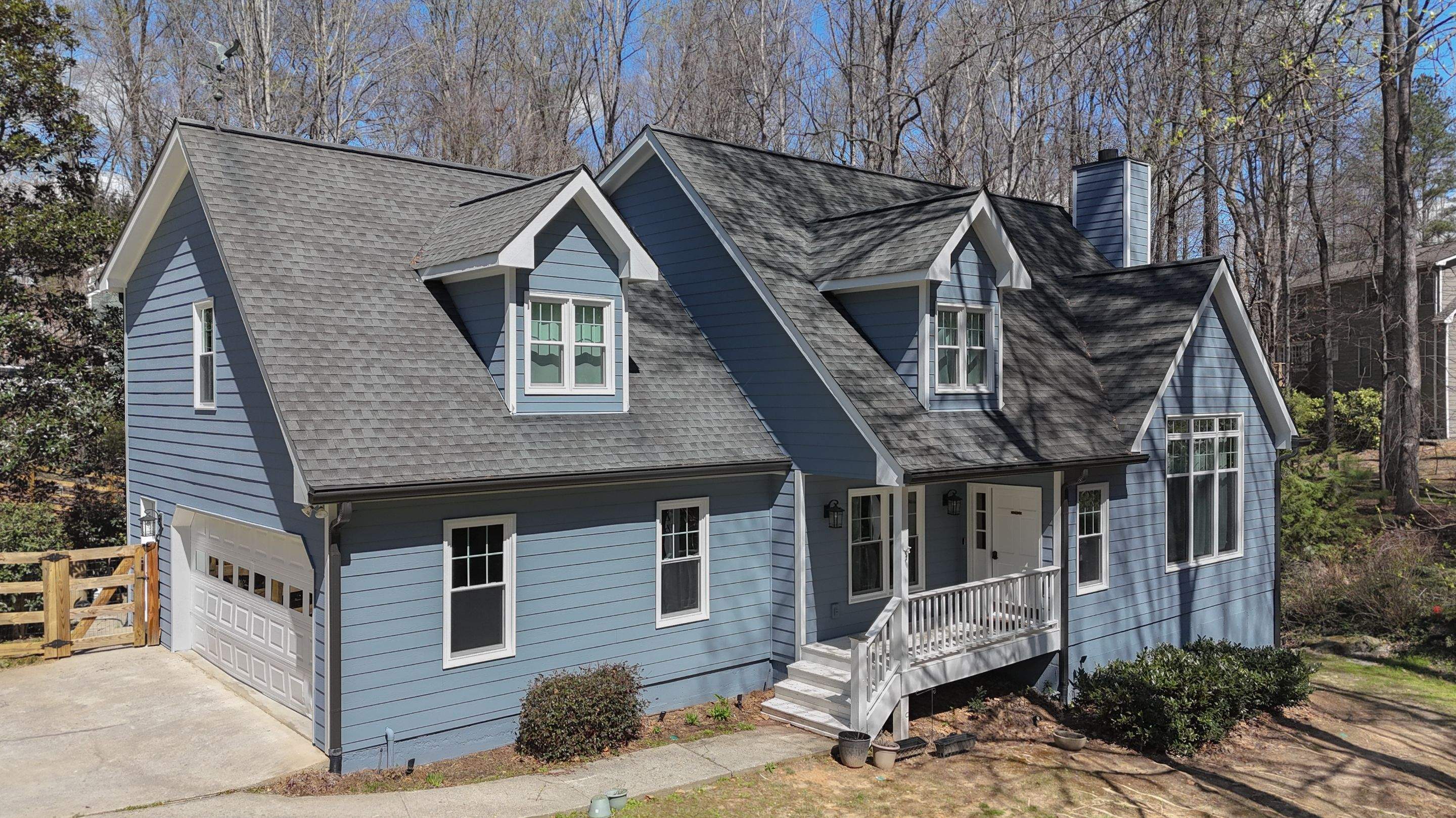Marietta, GA Full Siding Replacement, 30+ Window Replacements, Screened-In Porch to Sunroom Conversion, Gutter Replacement, and Exterior Painting by Nelson Exteriors
