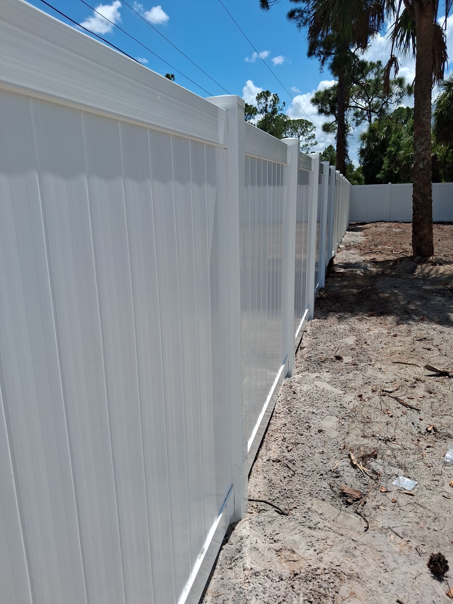 White Vinyl Privacy Fence Installation in North Port Florida by True Fence LLC