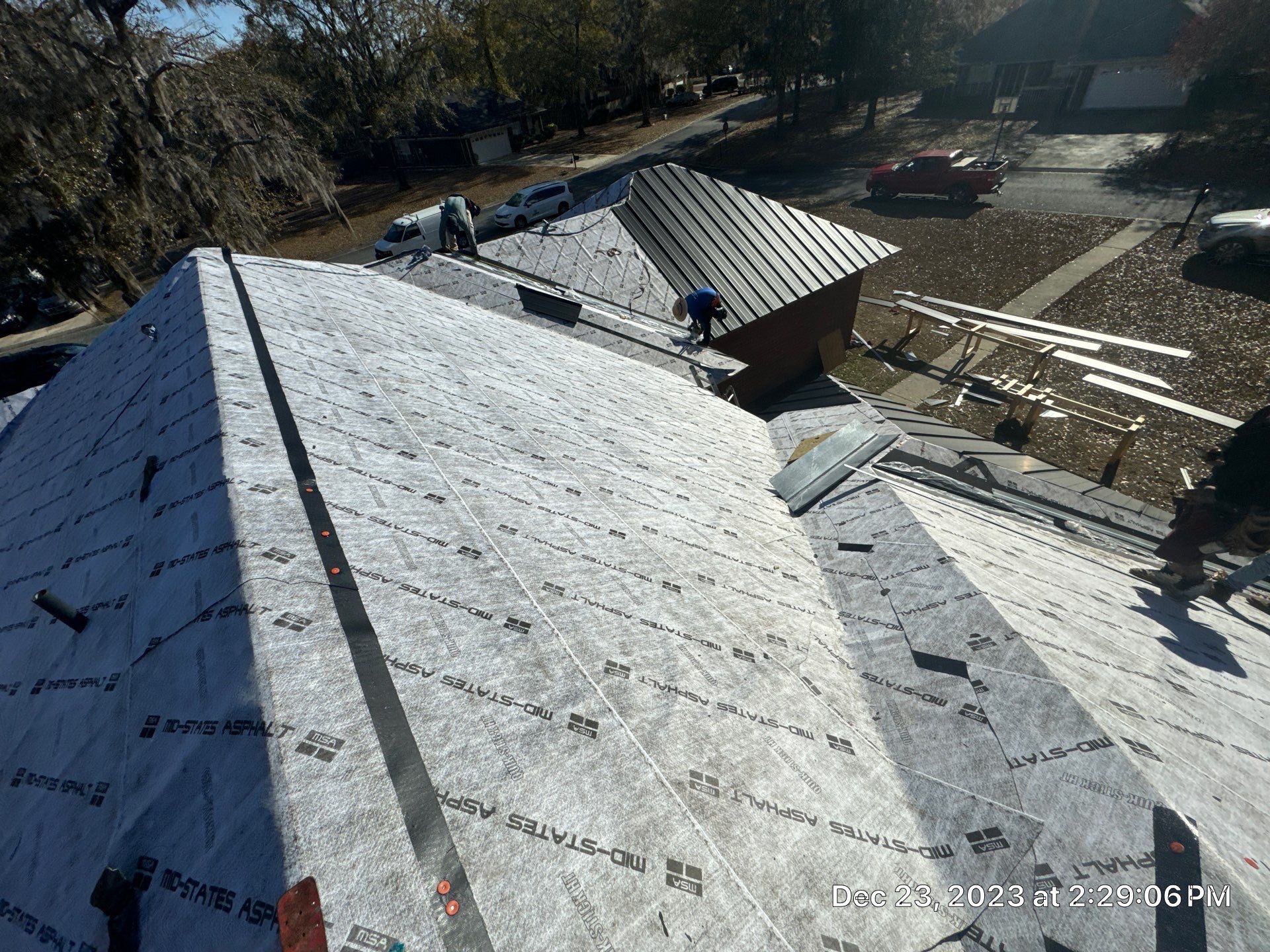 Residential Roofing Installation using Benton 26Ga 1inc Snapcock Metal Roof KYNAR Matte Black by Talya Roofing