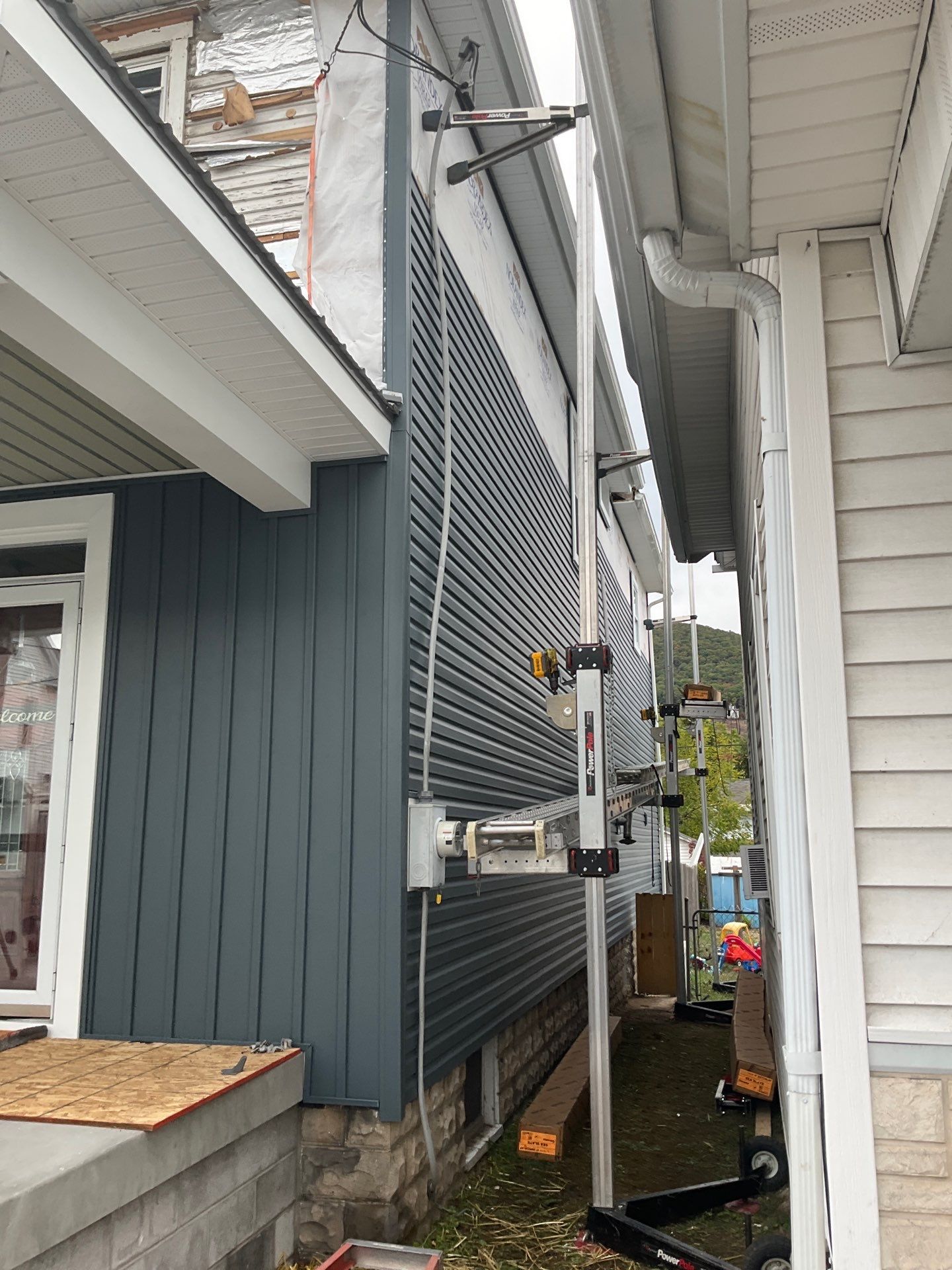 Charcoal Metal Roof & Blue Siding — A Refreshing New Look by Esh Builders