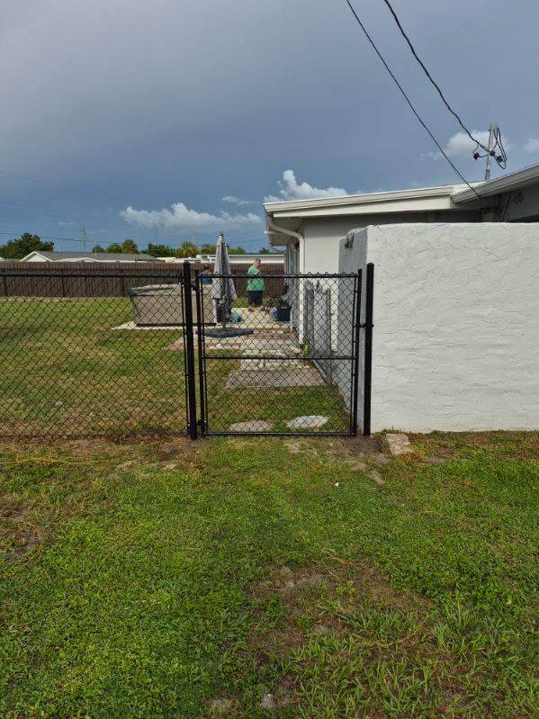 Black Chain Link Fence Installation for Residential Backyard in Port Charlotte by True Fence LLC