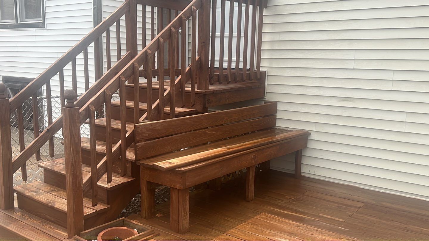 Wood cleaning and staining using Armstrong cloark oil stain by Northern Power Washing LLC.