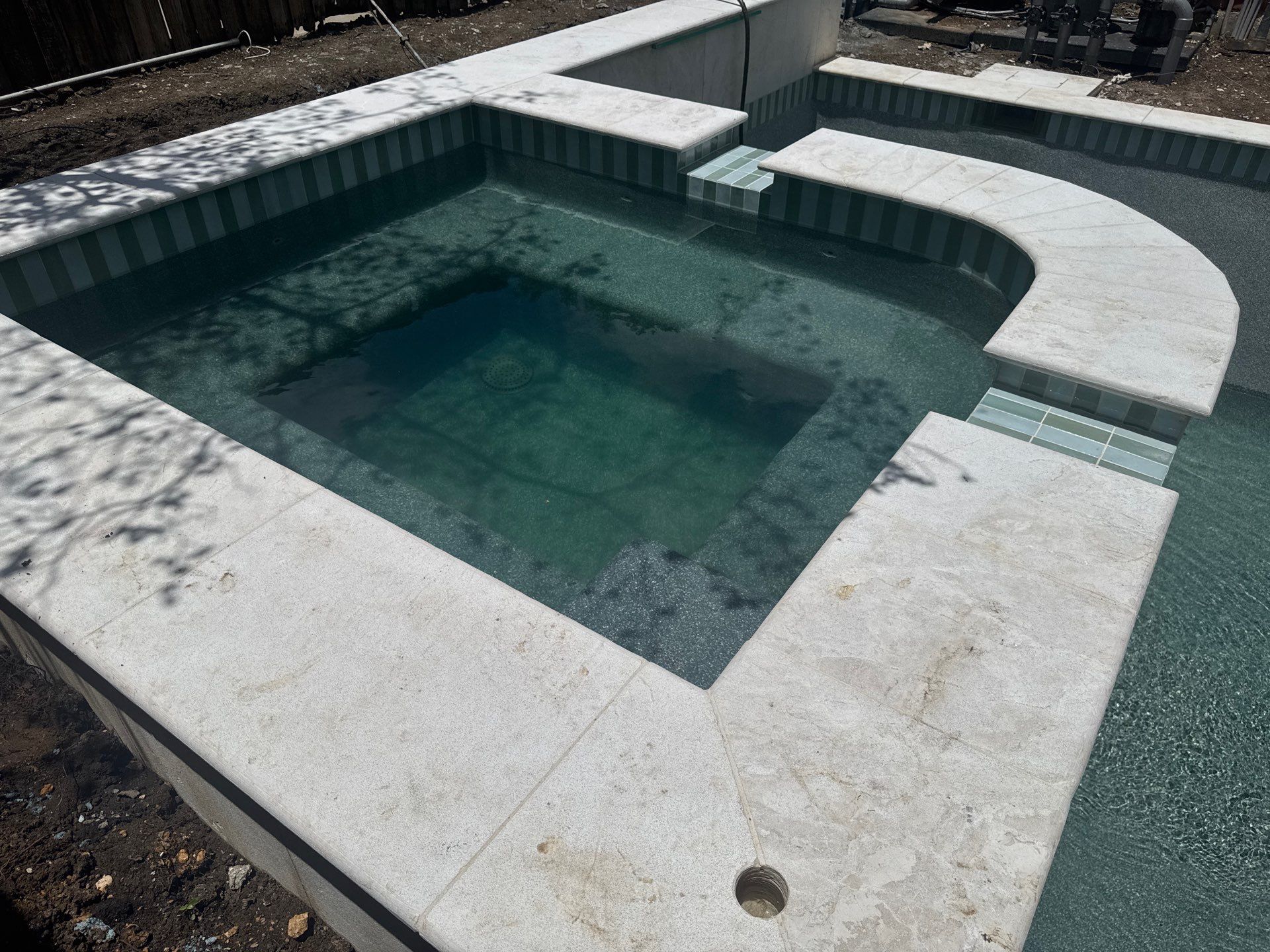 Modern Geometric Pool with Raised Spa and Travertine Deck by Pinnacle Pools and Spas - DFW
