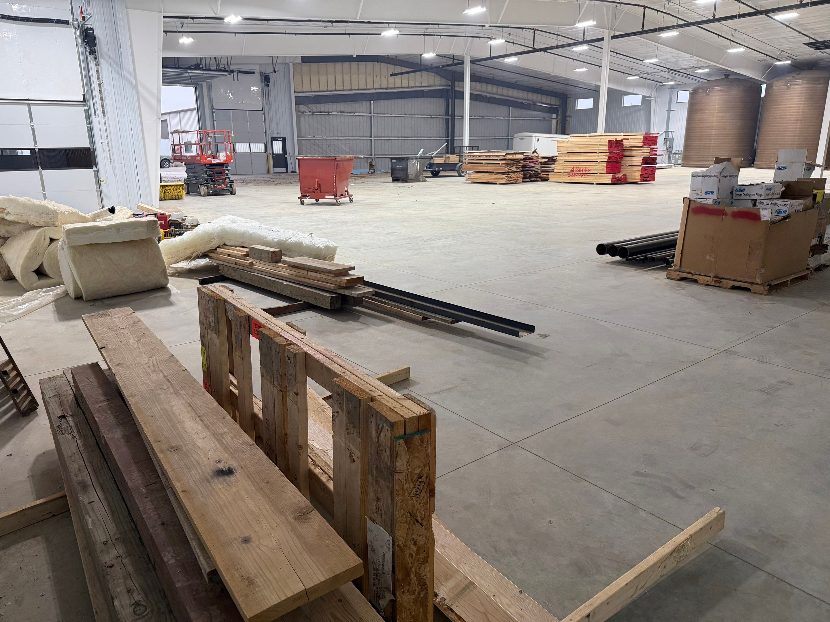 Industrial Concrete Polishing and Coating for Large Manufacturing Warehouse by Select Painting, Coatings & Garage Cabinets