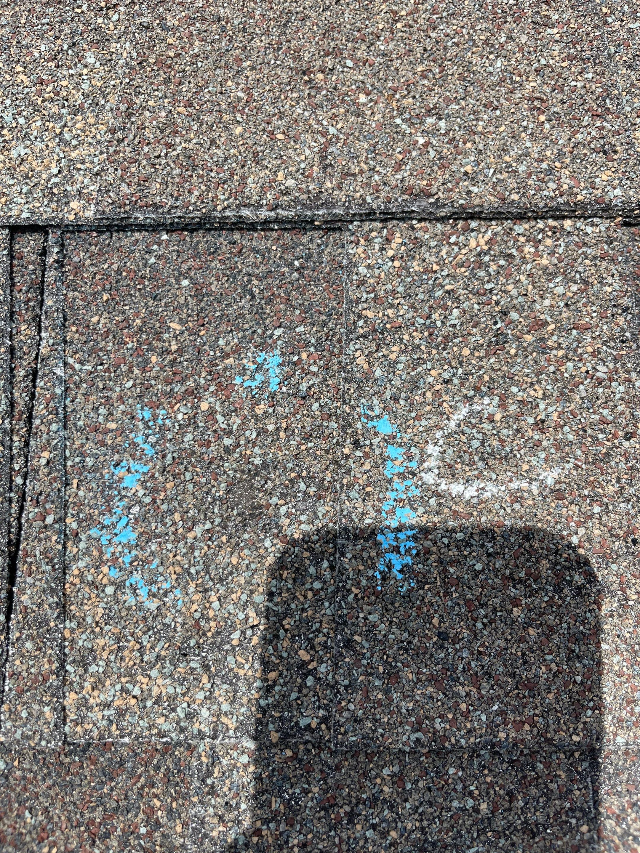 Hail Damage on a Roofing System by Icon Roofing And Construction 