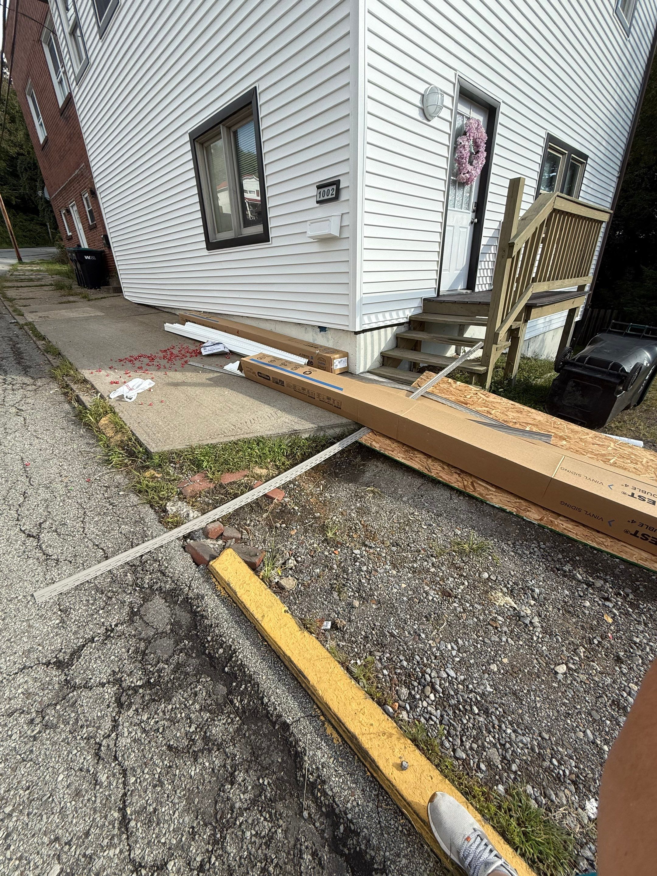 White siding  by Cousins Roofing Siding & Decks