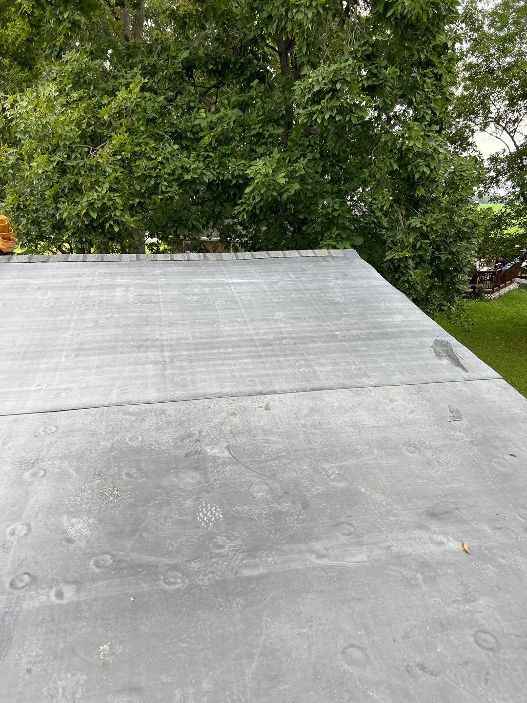 Residential Roofing Installation using 60 mil rubber roof  by Nitro Roofing and Construction