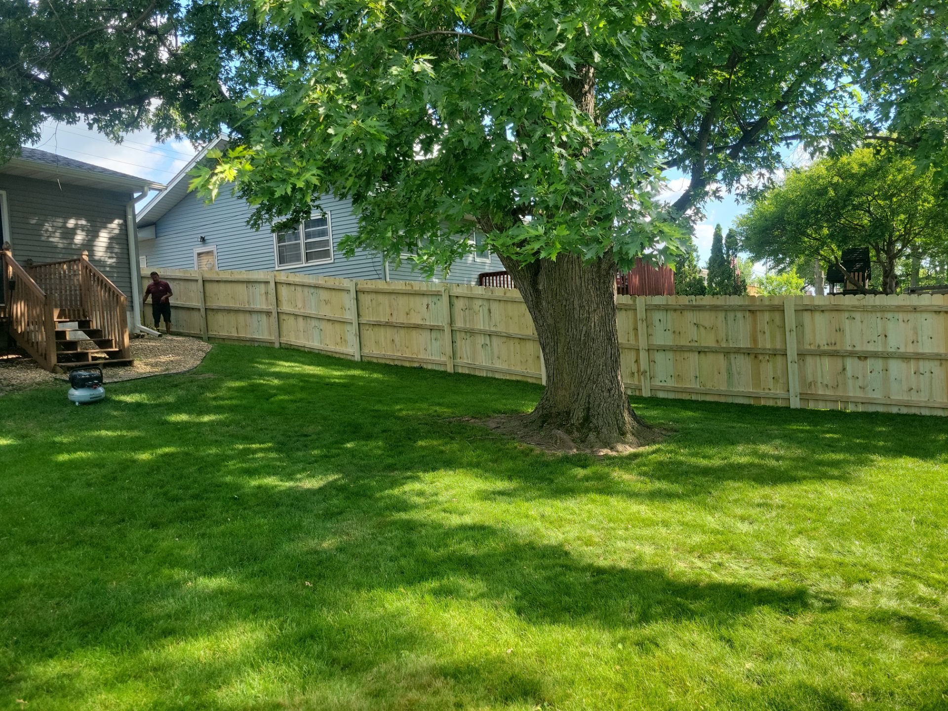 Pressure-Treated Pine Privacy Fence and Custom Gates in Waterloo by Perfect Picket Fence and Stain