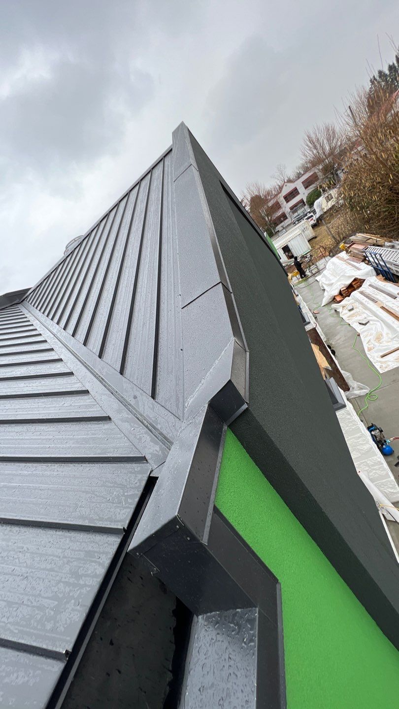 Commercial Roofing Installation using 12" Prolok metal and hidden gutters! by Top Notch Roofing Inc