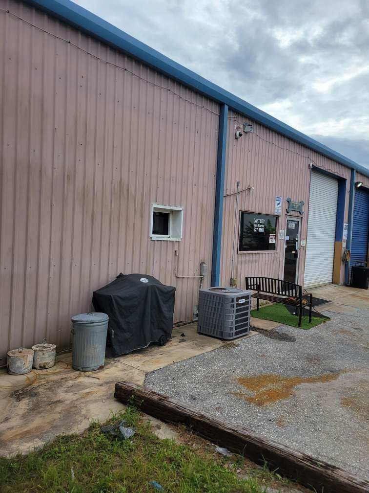 Black Aluminum Gutters with Matching Downspouts in Port Charlotte, FL by Gutter Professors