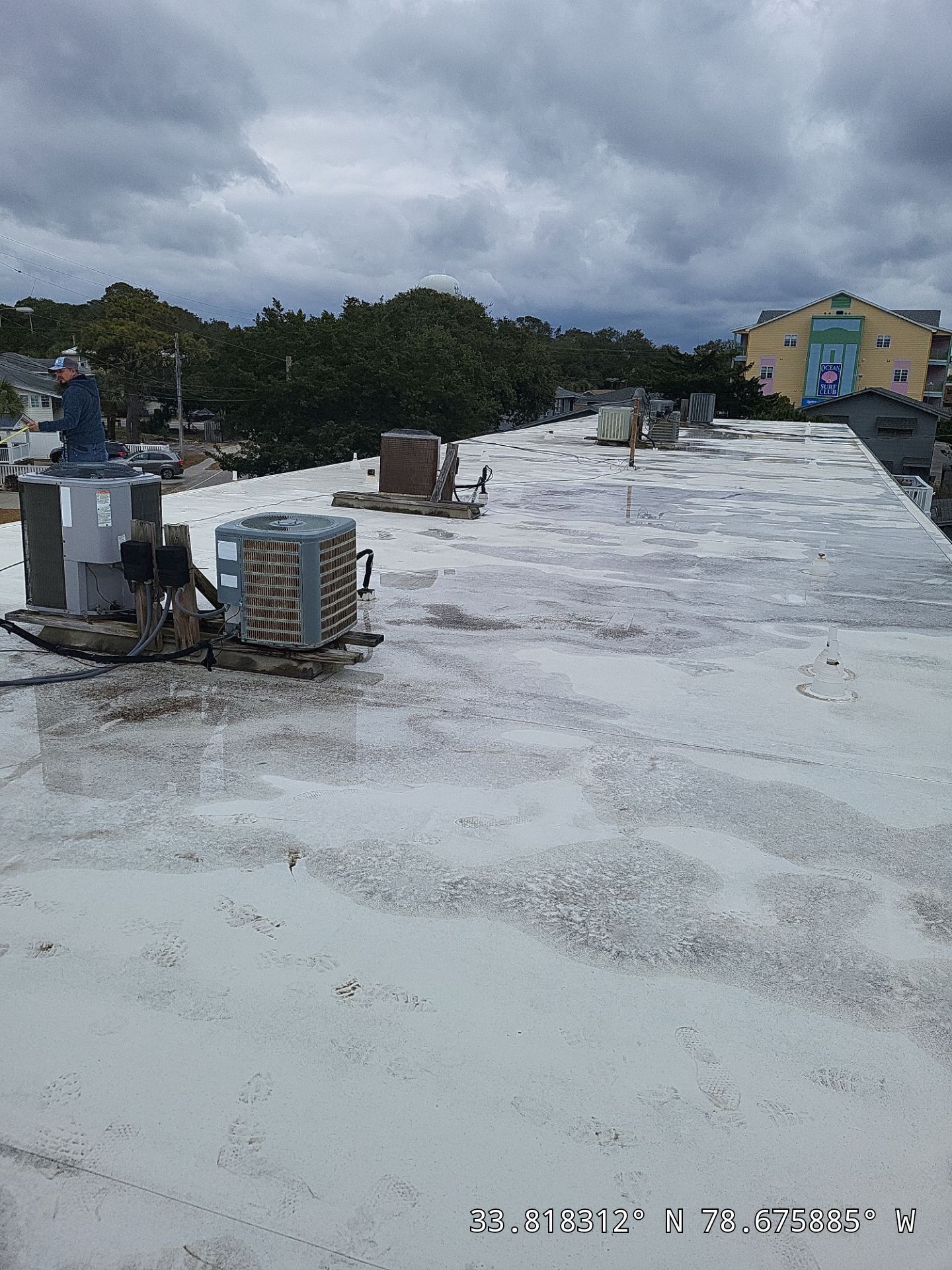 Commercial Building Roof Coating using 924 Eterna-Sil Premium Silicone Roof Coating by RGR Construction and Roofing, LLC