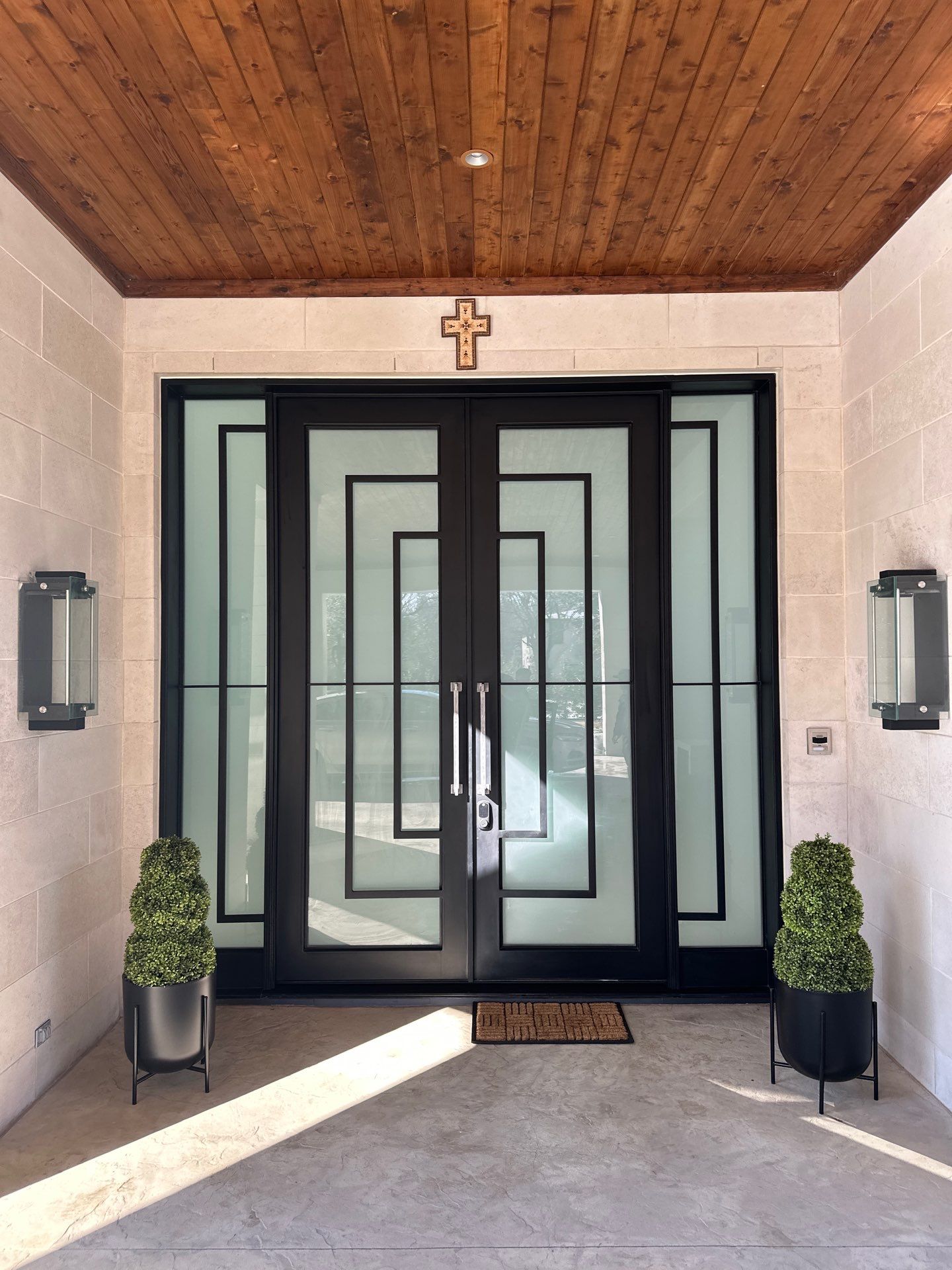 Modern Metal and Glass Entryway Installation with Custom Hardware Finishing in Dallas by Solara Custom Living