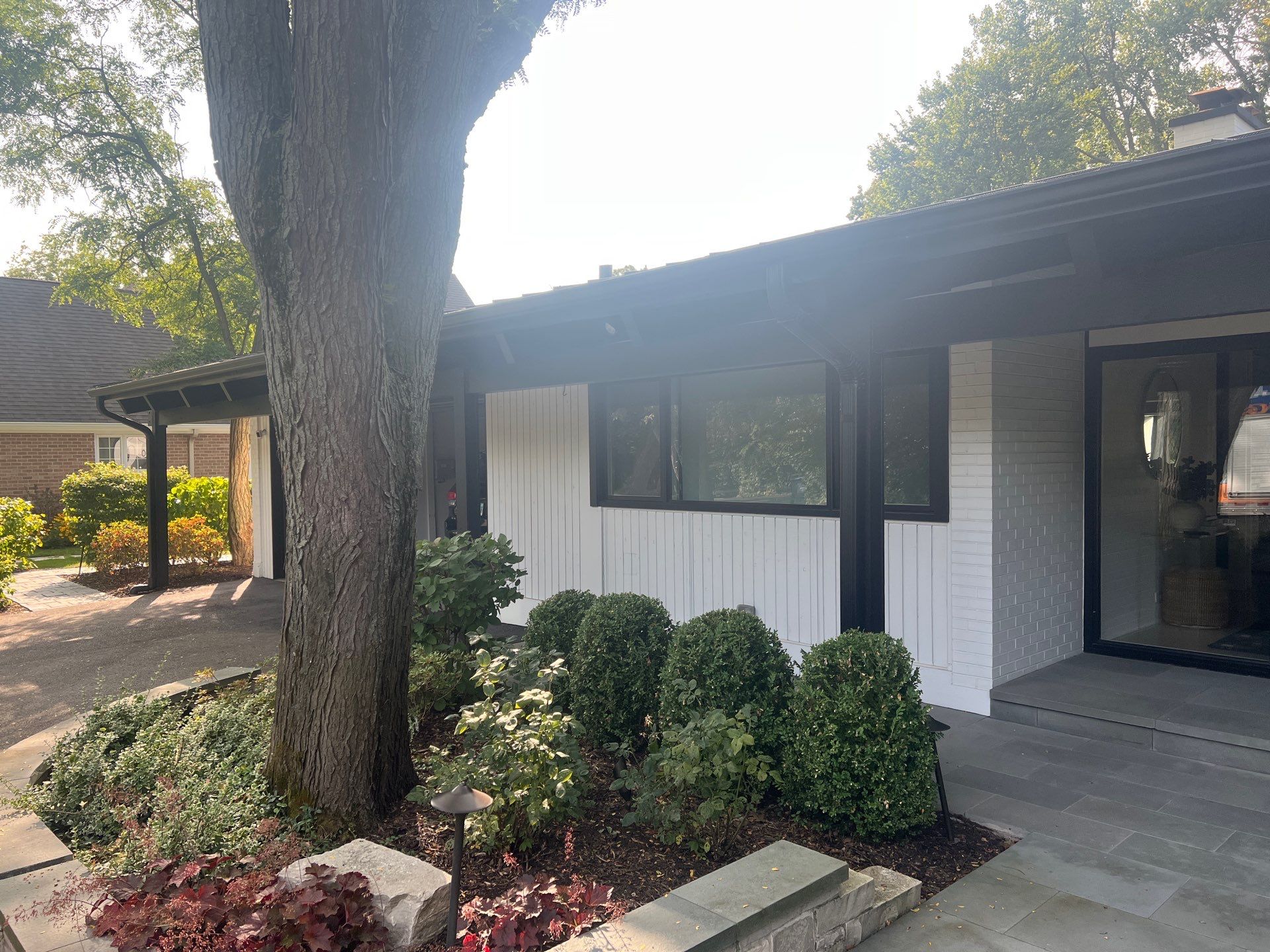Complete Exterior House, Bluestone & Garage Floor Cleaning by Northern Power Washing LLC.