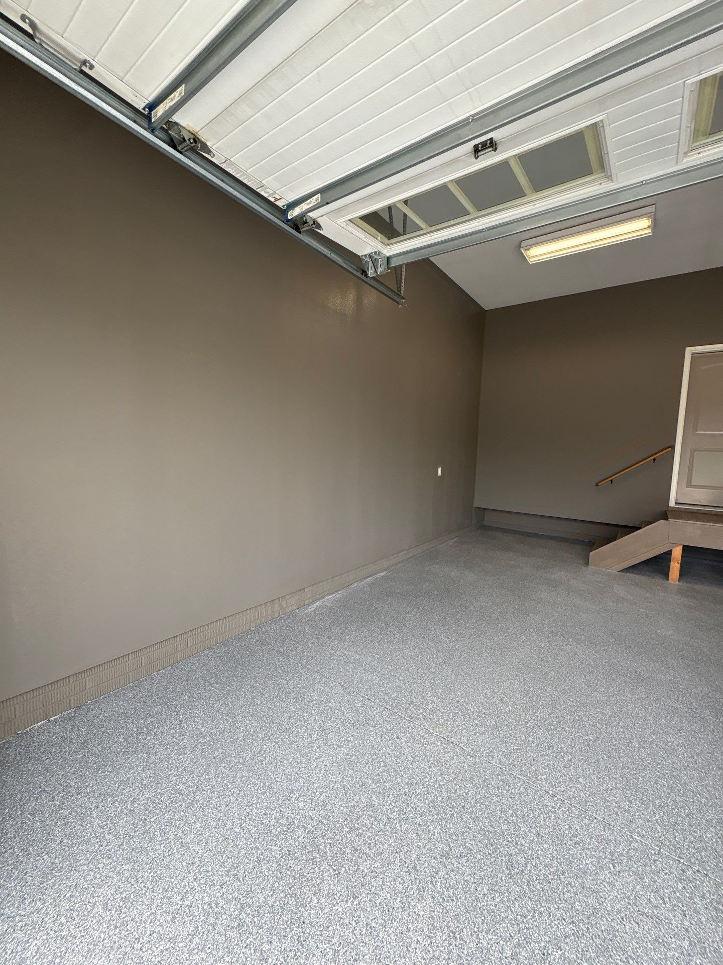 Speckled Grey Epoxy Garage Floor Coating Installation in Tea by Select Painting, Coatings & Garage Cabinets