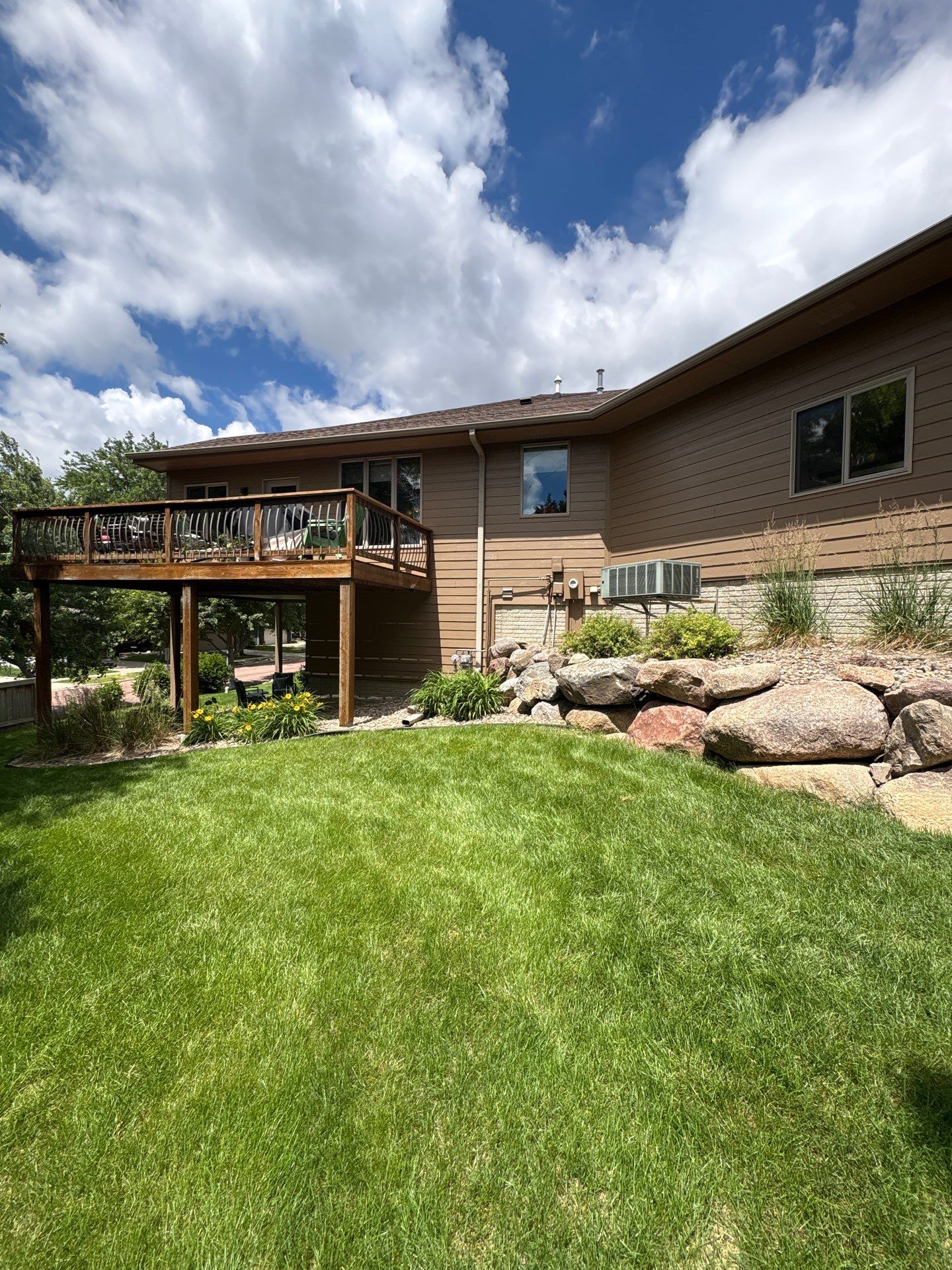 Multi-Story Residential Exterior Painting and Siding Refresh in Sioux Falls by Select Painting, Coatings & Garage Cabinets