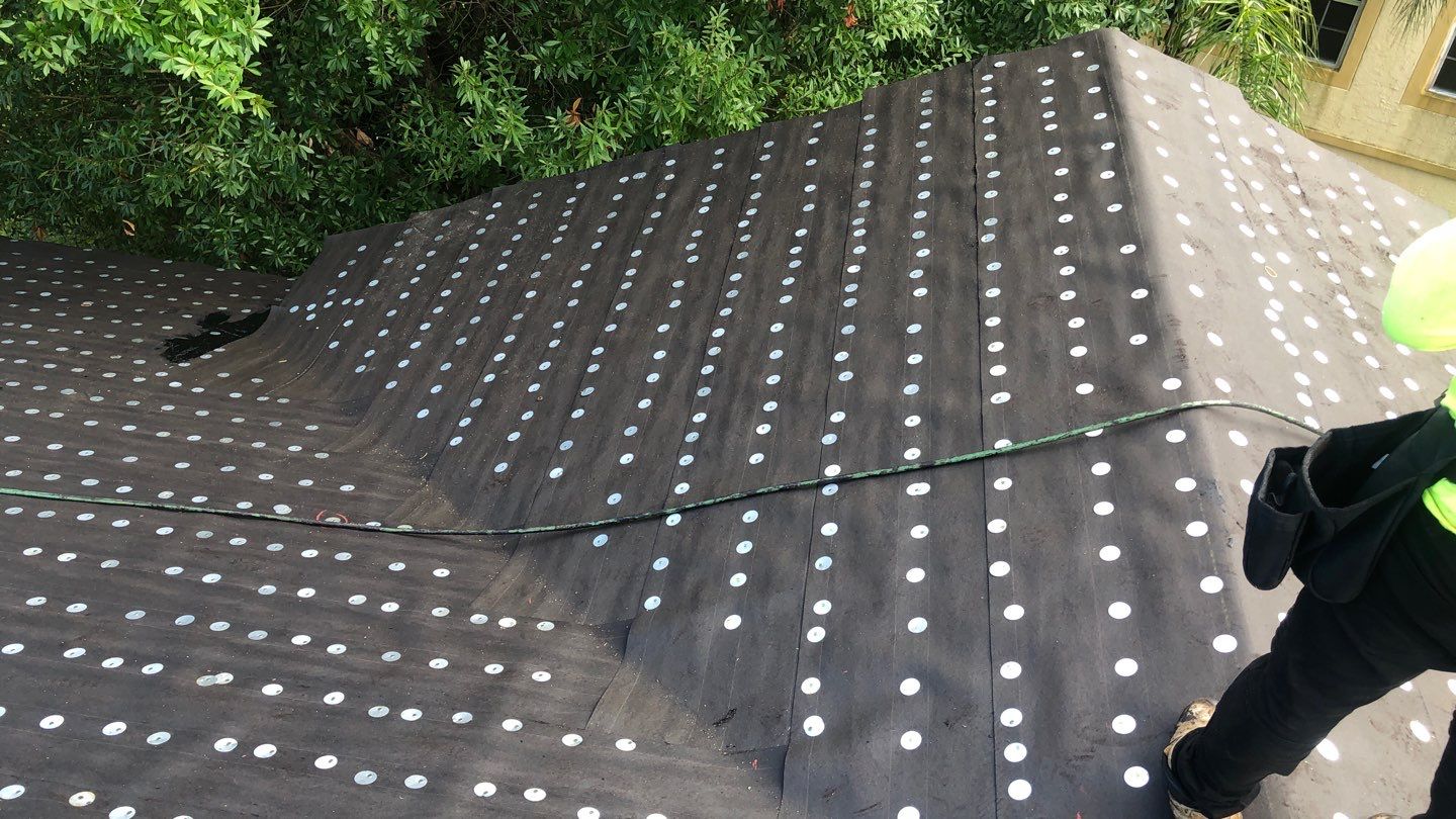 Commercial Roofing Installation using 1" Nail strip metal roof by BLUES BROTHERS ROOFING