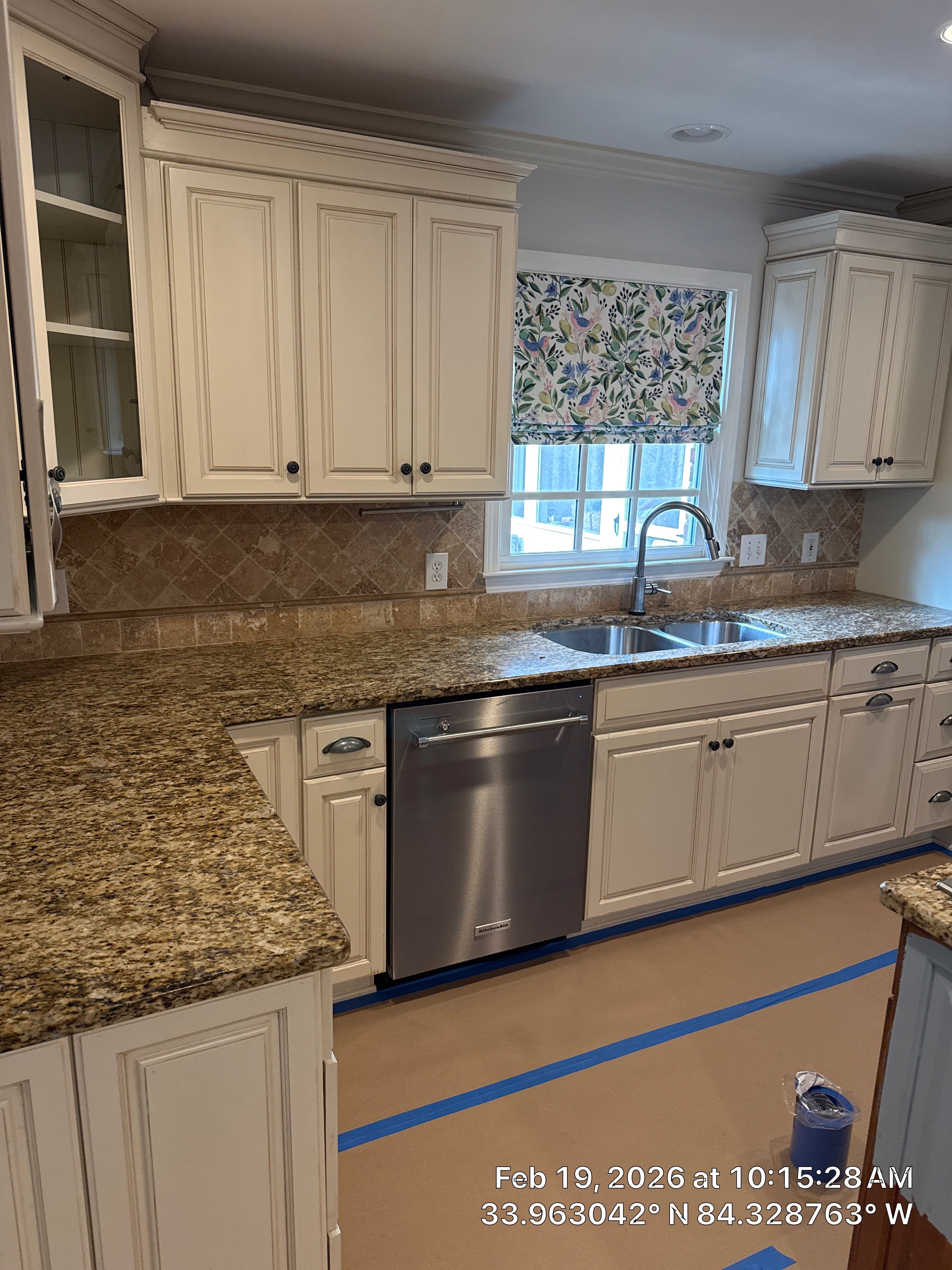 Kitchen Remodel in Dunwoody Featuring White Cabinetry and Blue Island by Heart & Home Kitchen & Bath Remodeling LLC