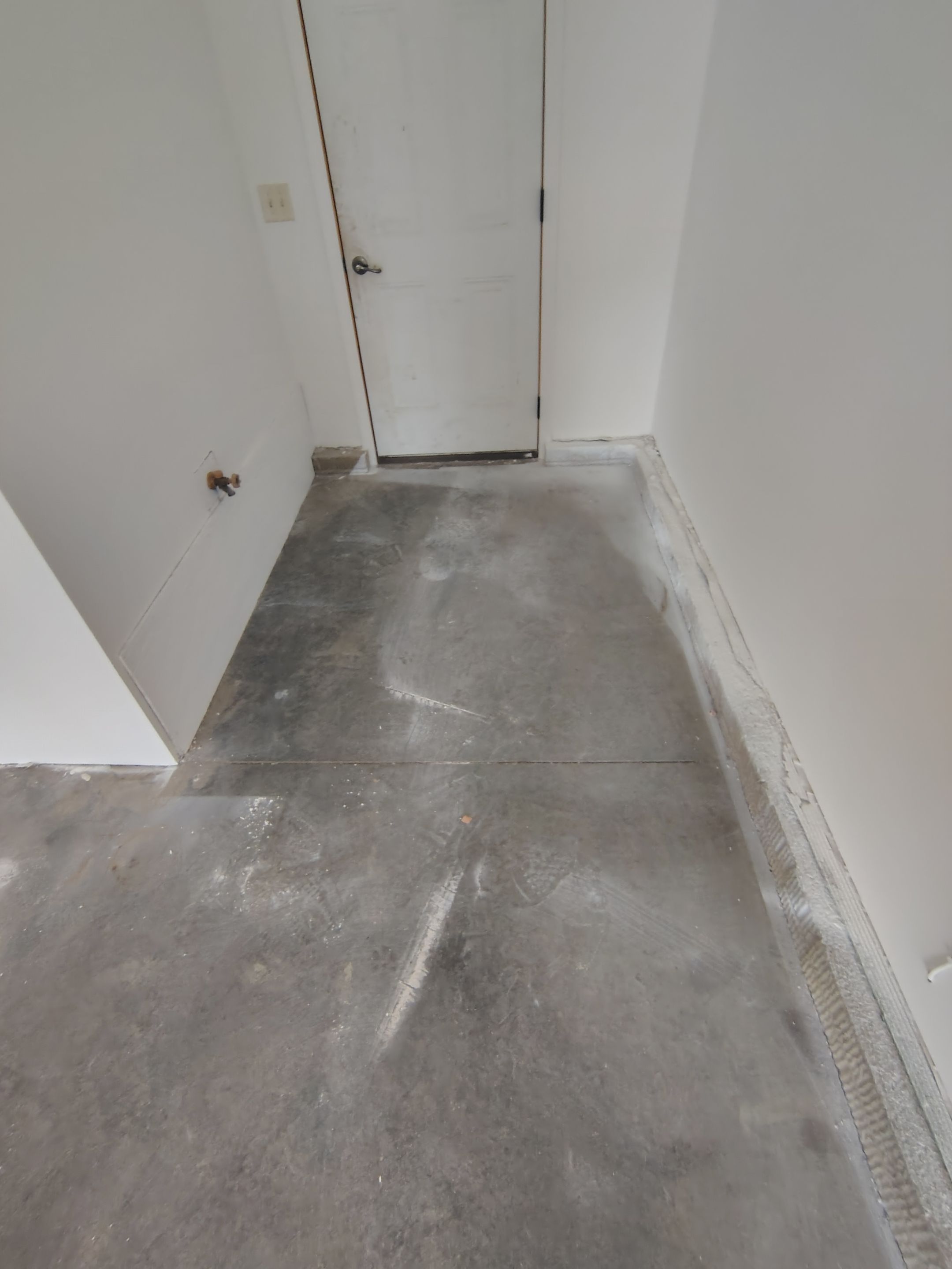 Custom Grey Speckled Epoxy Floor Coating for Sioux Falls Garage by Select Painting, Coatings & Garage Cabinets