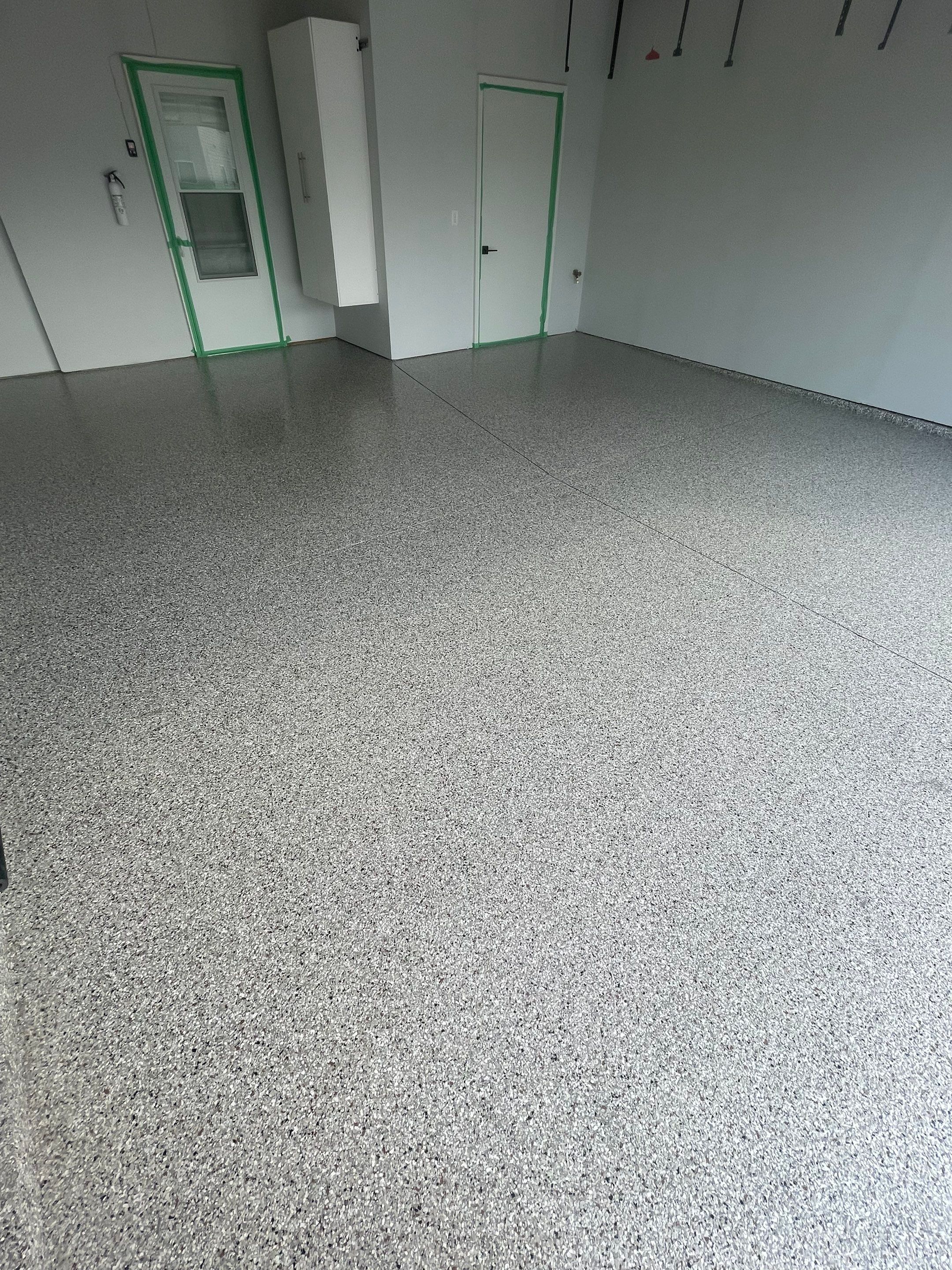 Custom Coyote Flake Garage Floor Coating in Sioux Falls by Select Painting, Coatings & Garage Cabinets