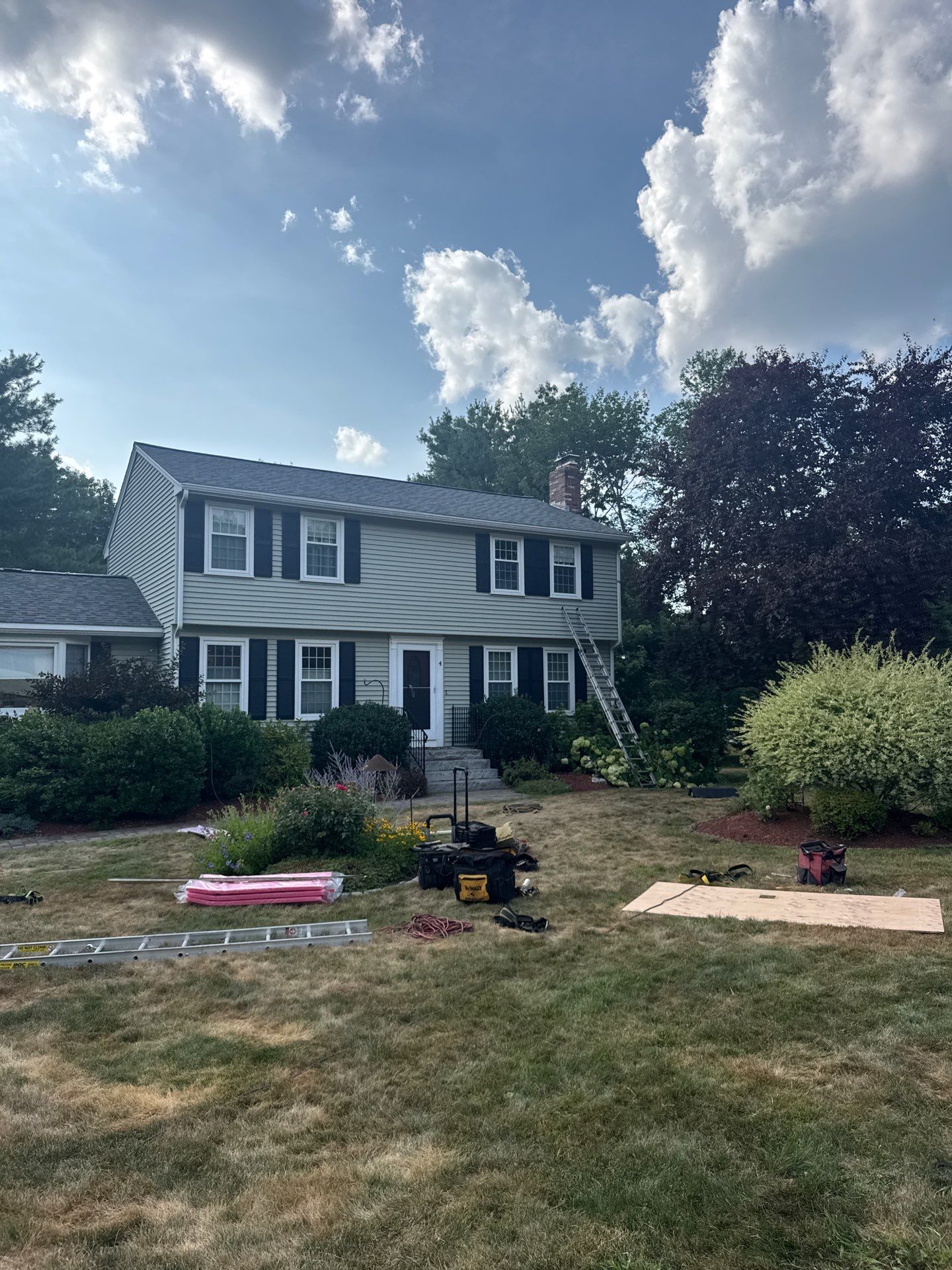 Complete Roof Replacement with Chimney Flashing, Gutter Guard System, and Vinyl Siding Repairs by Mighty Dog Roofing of Greater Middlesex County
