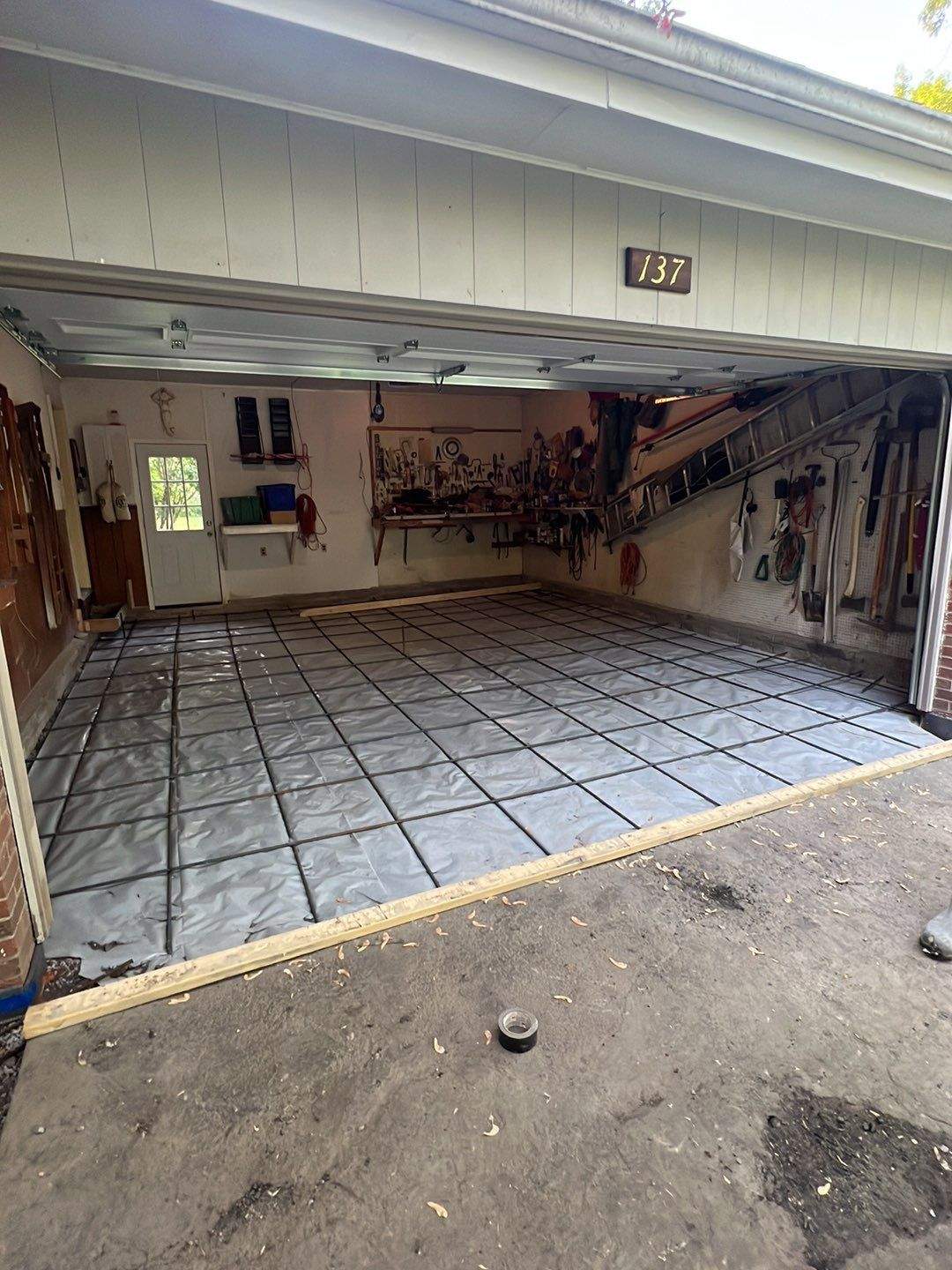 Concrete garage floor replacement  by NG Masonry & Construction LLC