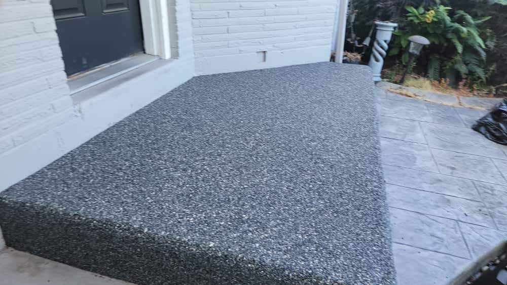 Charming Compact Patio in Vuba Stone by Concrete Coating Experts Inc.