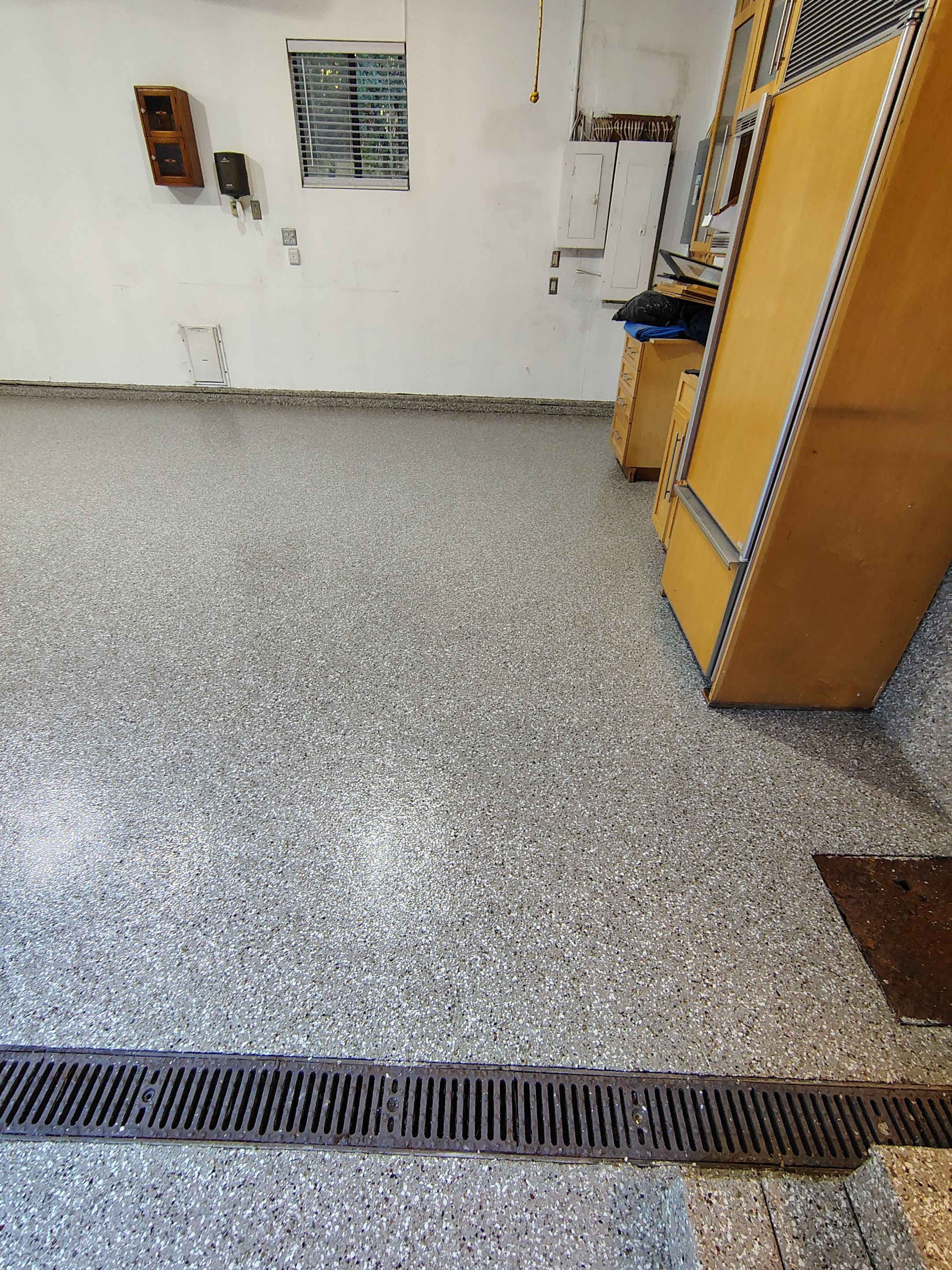 Garage Floor and Entry Step Concrete Coating in Sioux Falls by Select Painting, Coatings & Garage Cabinets