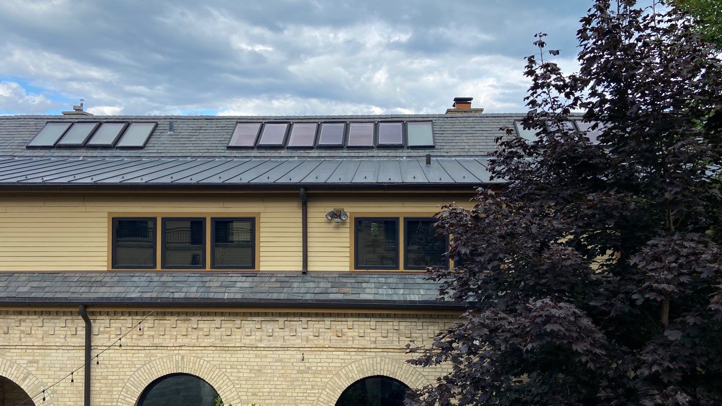 Slate Roof Replacement and Half Round Copper Gutter Installation by Custom Installations