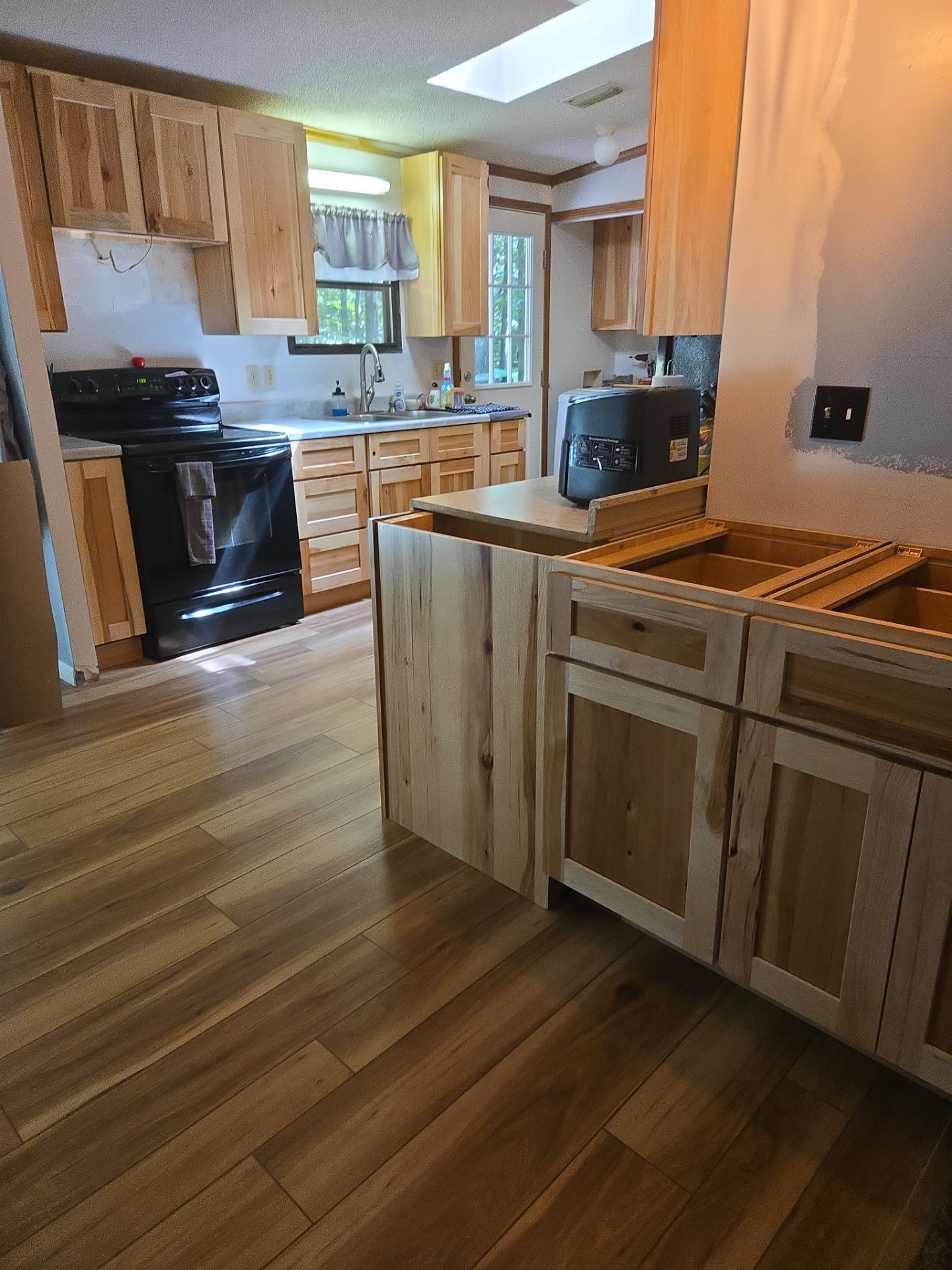 Stunning Kitchen Transformation with Raw Hickory Cabinets by A Step Above Handy LLC 