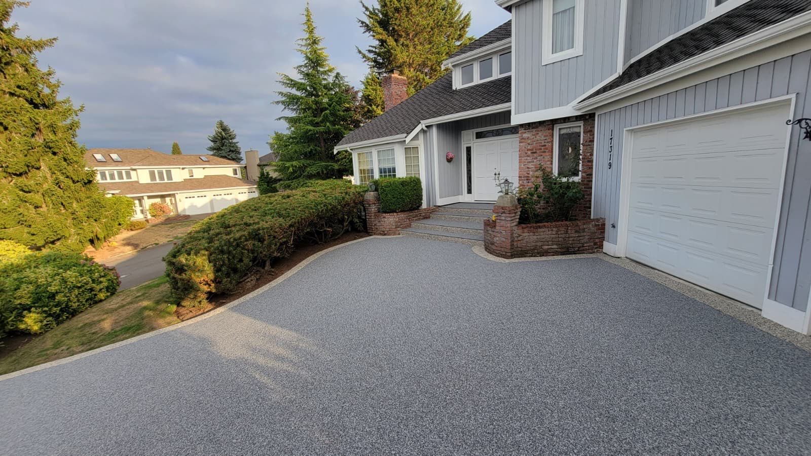 Elegant Driveway and Patio in Palazzo Vuba Stone by Concrete Coating Experts Inc.