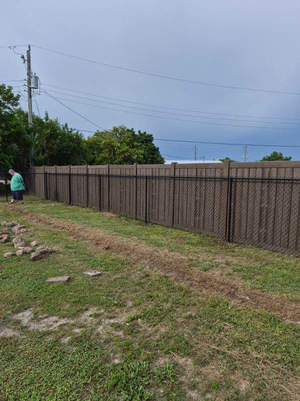 Black Chain Link Fence Installation for Residential Backyard in Port Charlotte by True Fence LLC
