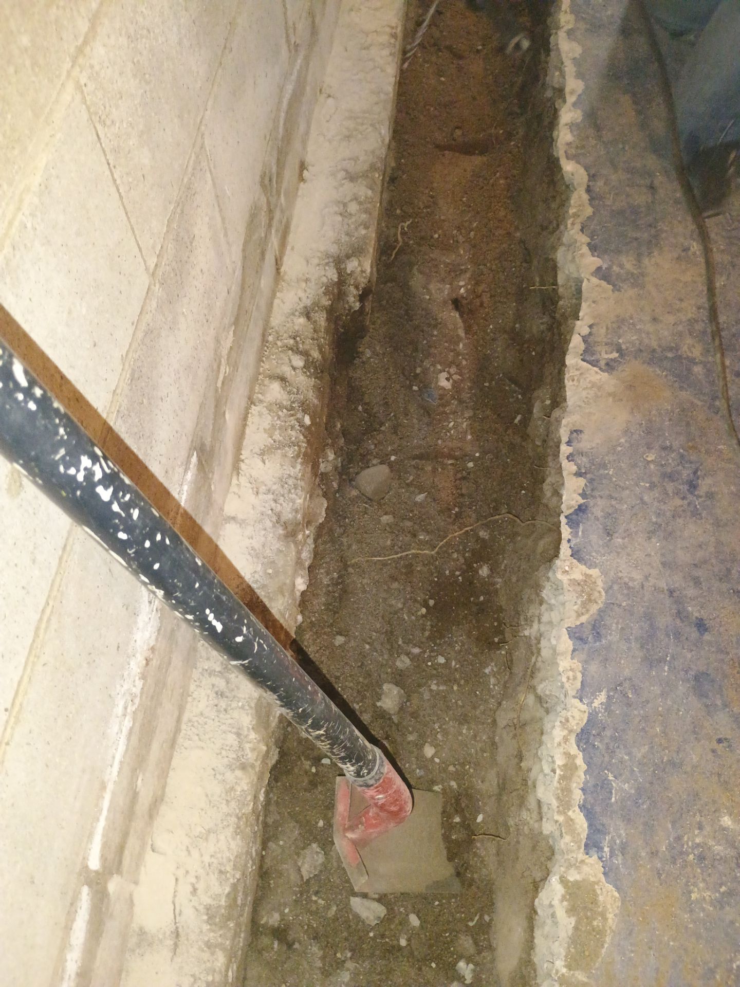Interior Drain Tile & Buried Discharge in South Minneapolis by Waterproofing Northeast