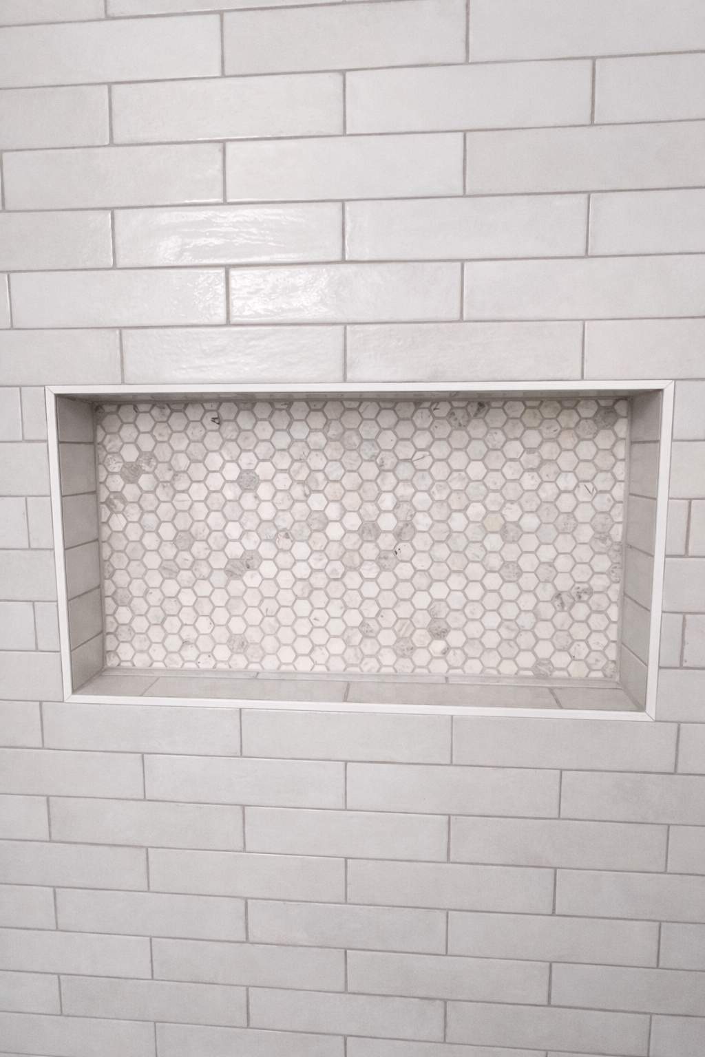 Stone Oak Hall Bathroom Remodel with Pink Vanity and Curved Shower Glass by Legacy Bath and Kitchen 