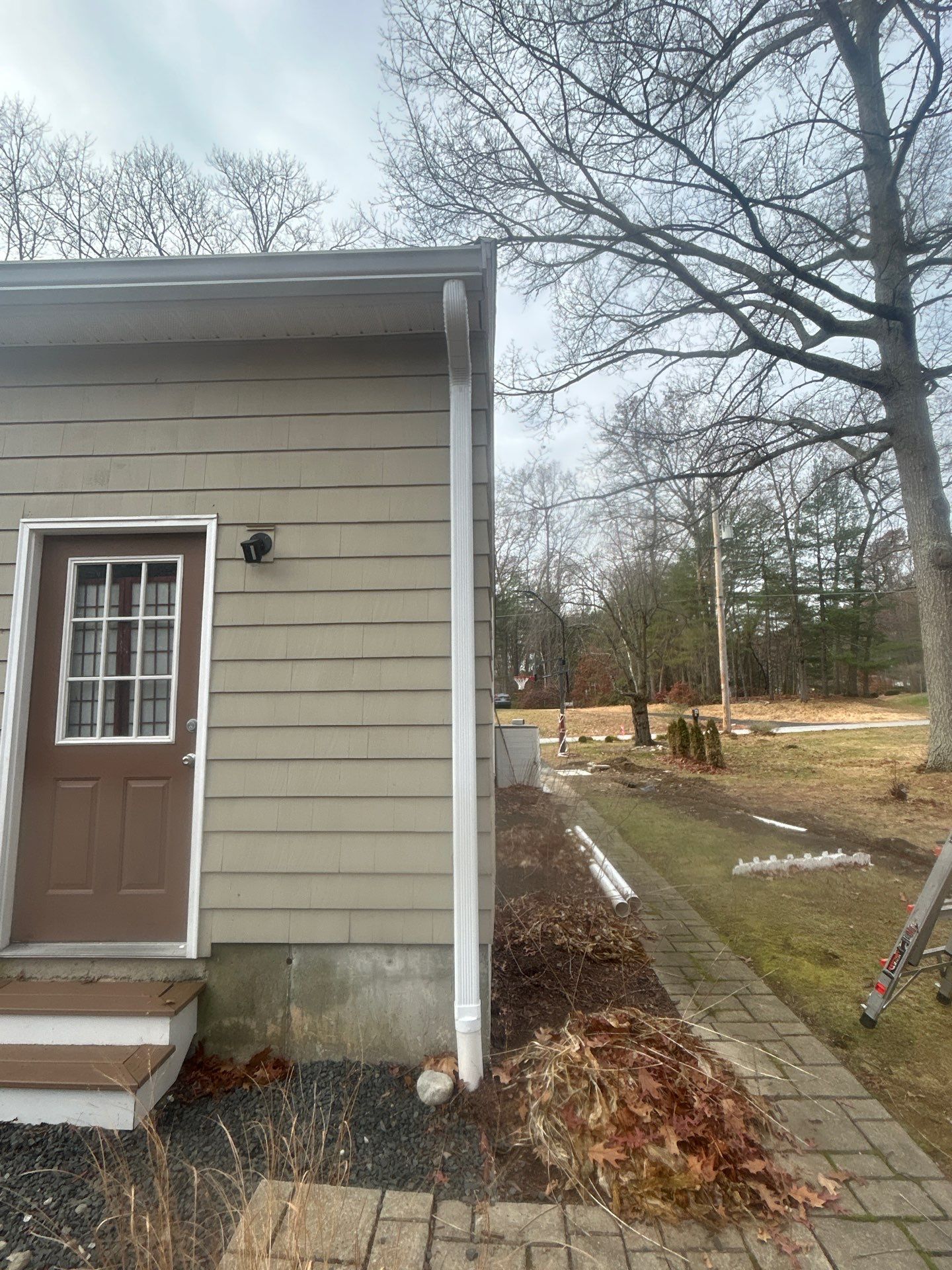 Chelmsford Garage Gutter System with French Drain Integration by Mighty Dog Roofing of Greater Middlesex County