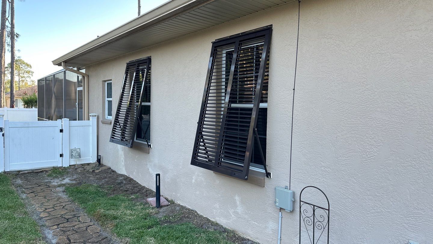 Hurricane Rated Bahama Shutters in Gray Brown by Smart Guard Shutters