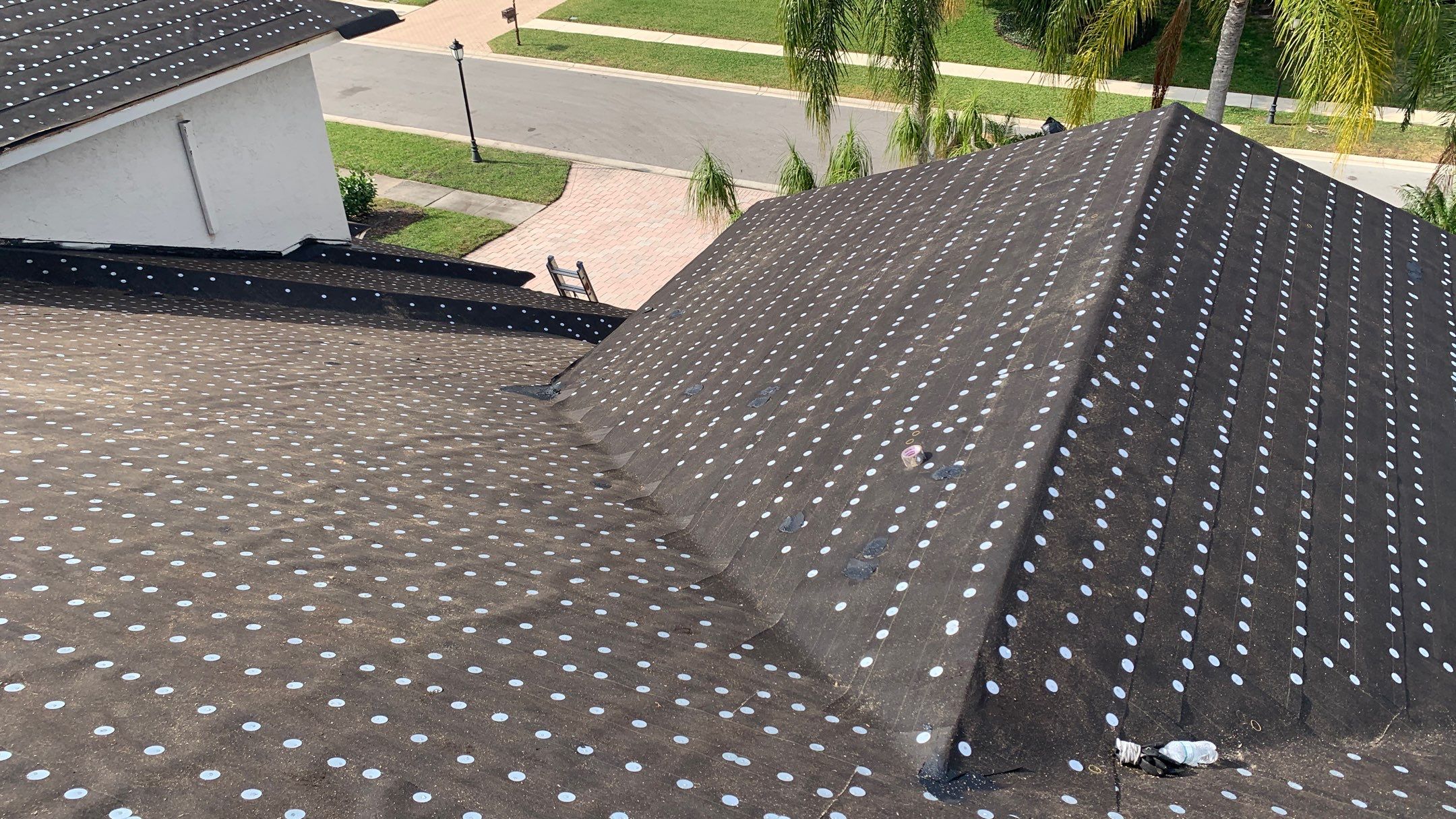 Residential Roofing Installation using 1" Nail strip metal roof by BLUES BROTHERS ROOFING