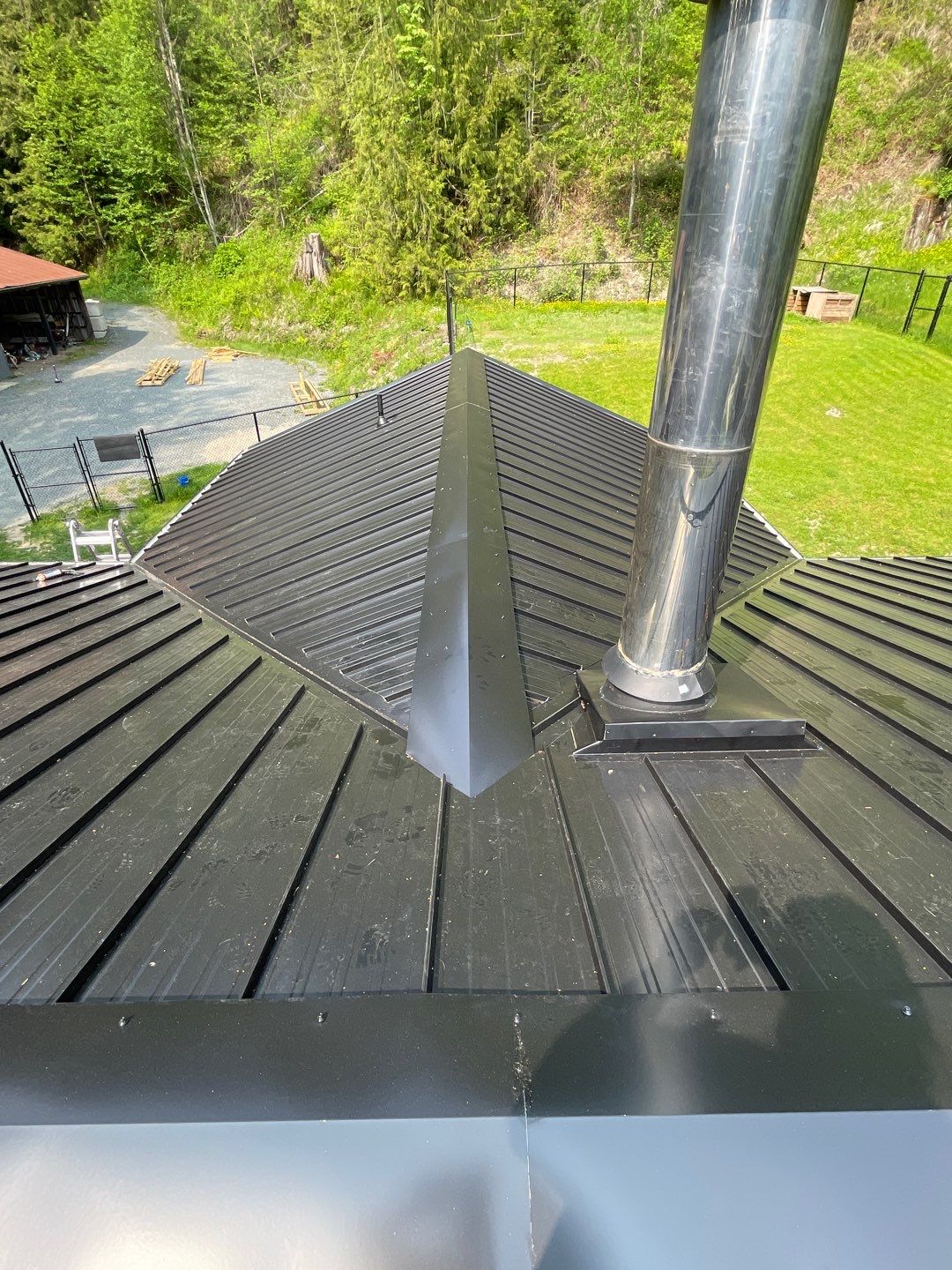 Residential ReRoofing Installation using 12" Prolok metal by Top Notch Roofing Inc