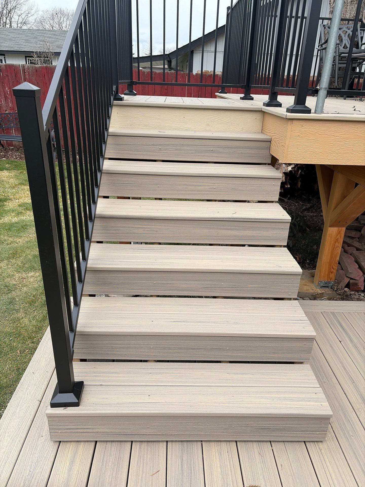 Add a platform deck below an existing elevated deck that was there prior by Home Helpers General Contracting