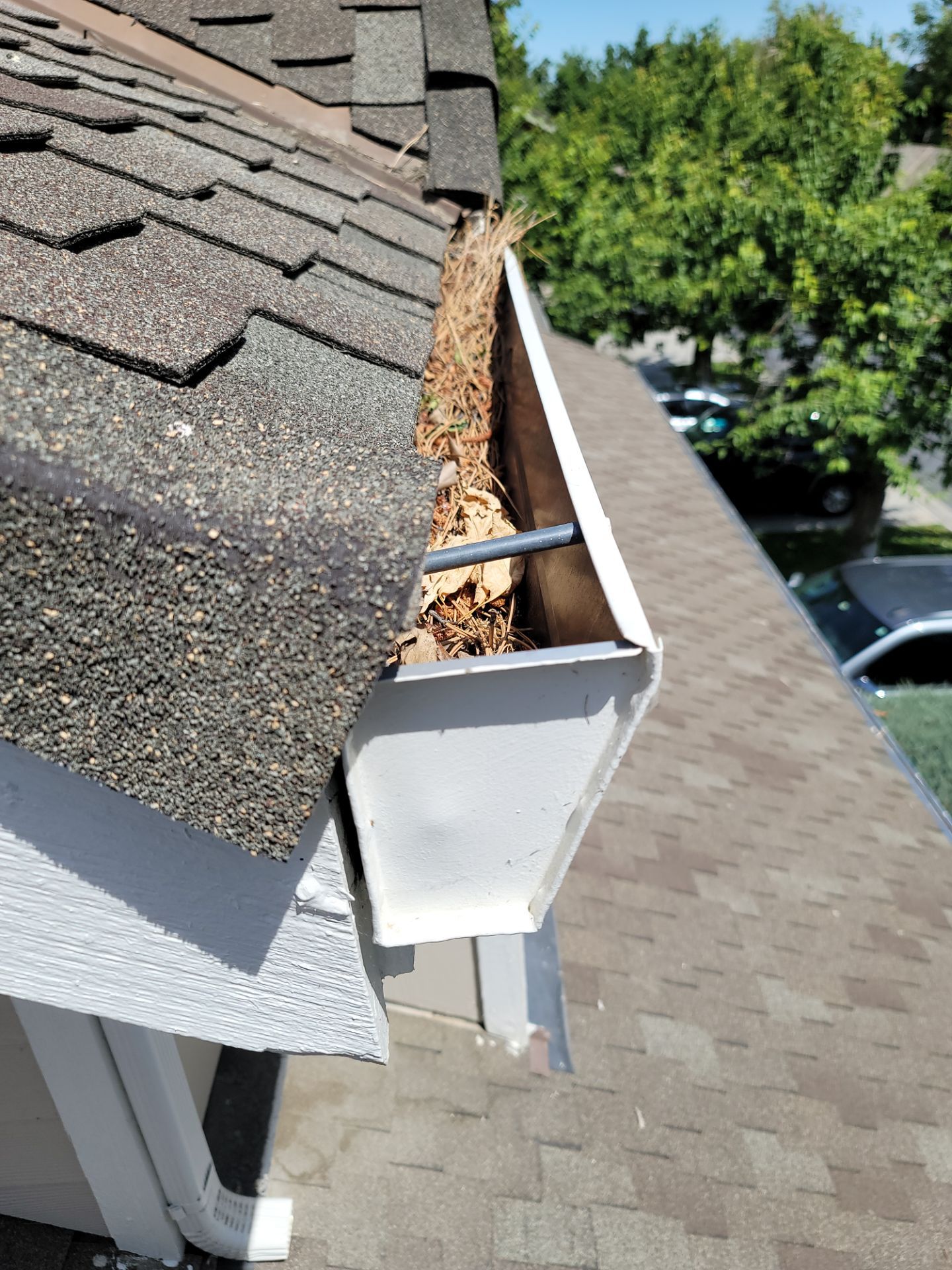 Commercial gutter cleaning Yakima & Tri Cities before photo with filled gutters