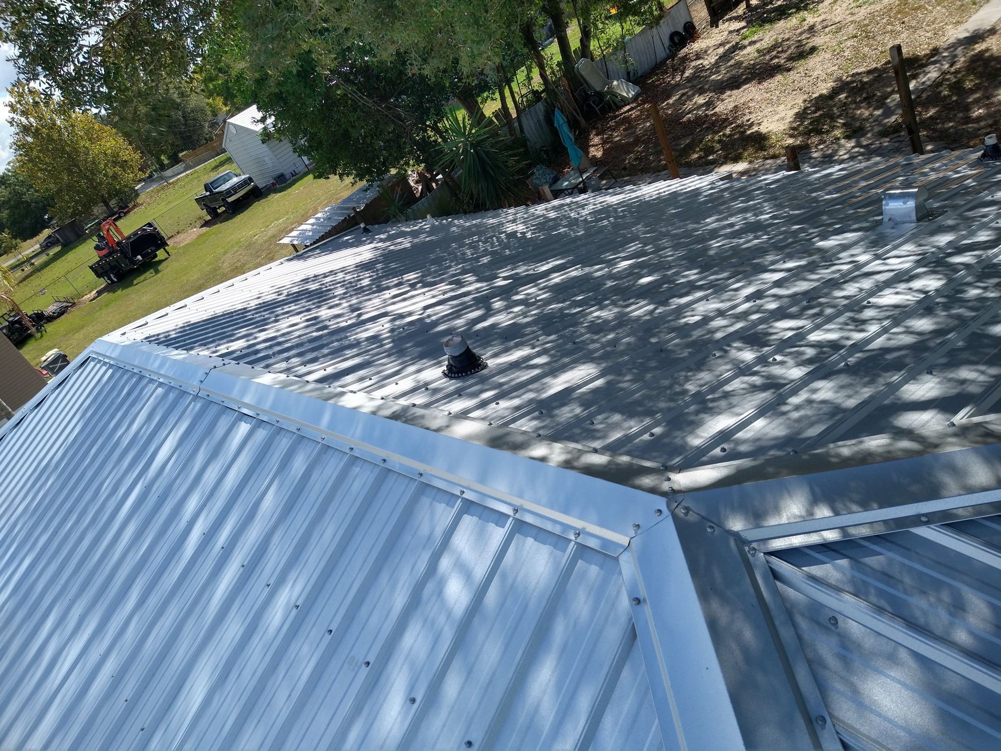 Residential Roofing Installation using 26 GA Rib Panel Galvalume by 1st Class Roofing, Inc.