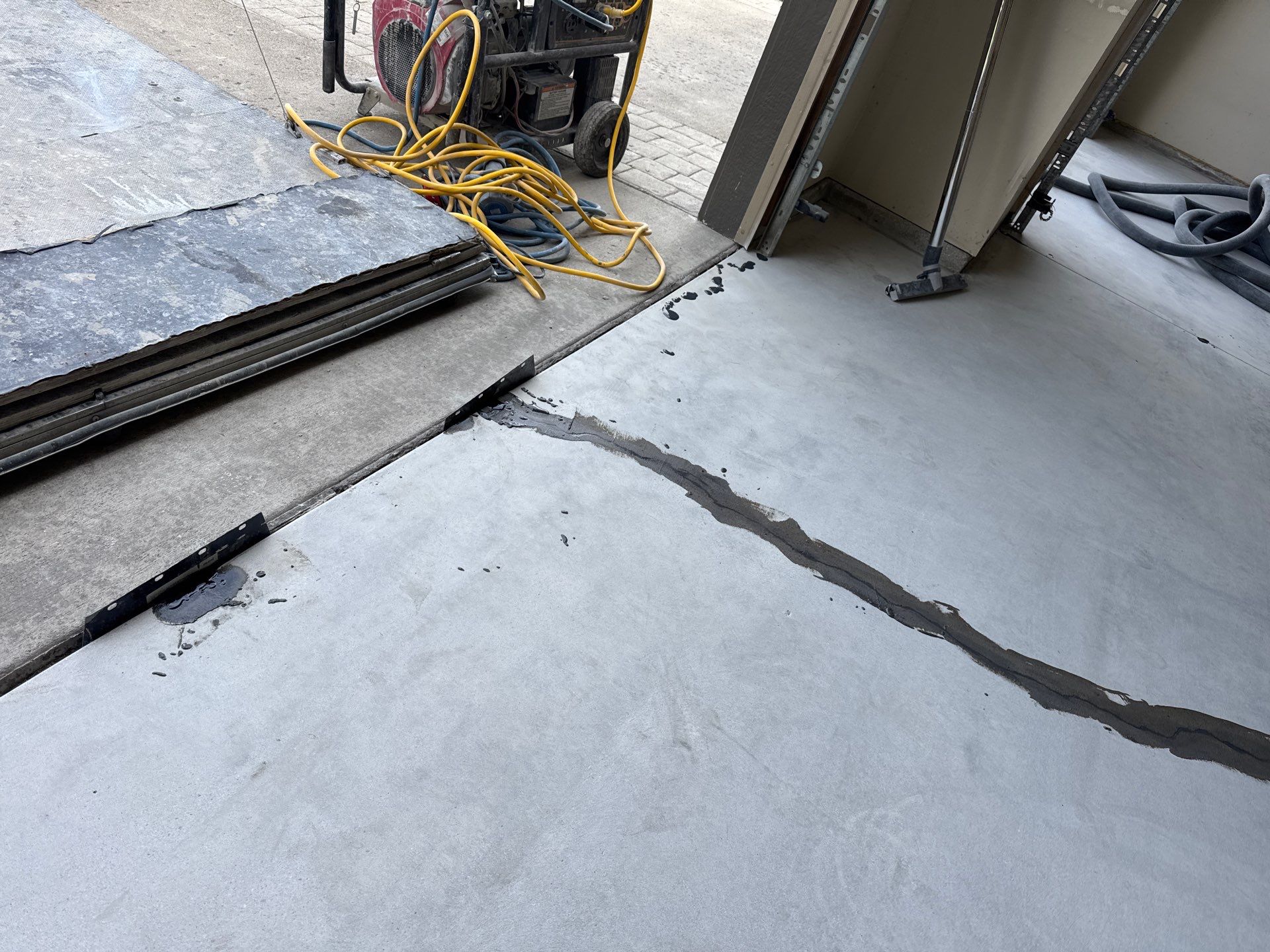 Custom Gray Speckled Polyaspartic Garage Floor Coating in Cheney by Croc Coatings, LLC