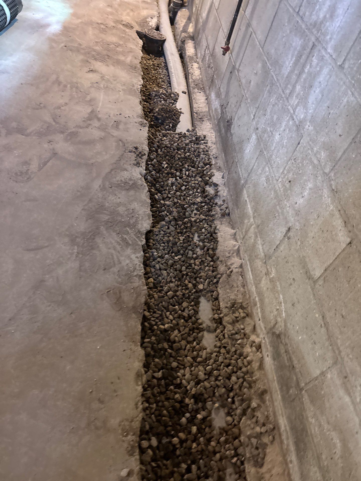 Interior Drain Tile & Buried Discharge in South Minneapolis by Waterproofing Northeast