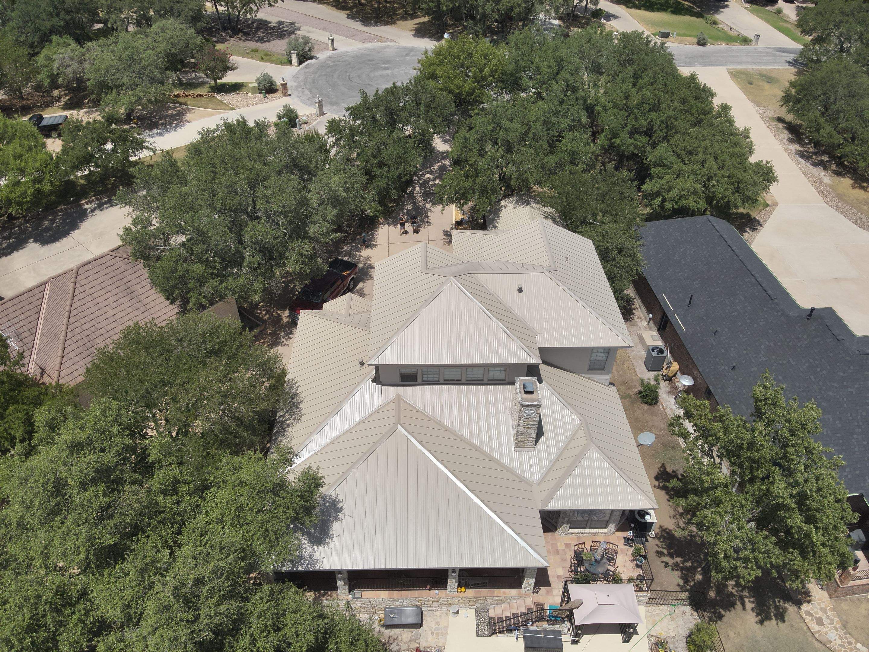 Residential Roof Replacement using 24 GA Double-Lock - Surrey Beige by Action Exteriors Austin